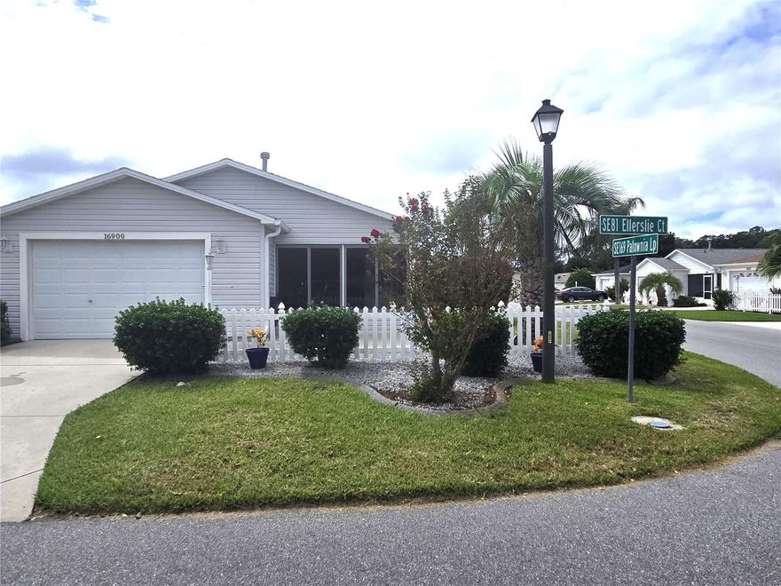 Fantastic location for this Villa in The Villages — just minutes from the Nancy Lopez Country Club! This corner unit features volume ceilings, an open floor plan, and no carpet throughout. The BOND IS PAID, and the home is in excellent condition with updated paint and Luxury Vinyl flooring plus a NEW ROOF (2023). The kitchen offers New Stainless appliances in 2023, a breakfast bar and closet pantry, opening to a bright, spacious living area filled with natural light. Plantation shutters to accent the windows. Screen enclosed lanai at front entry. Enjoy your private side patio, perfect for morning coffee or evening grilling, with a hedge for added privacy. The garage with Epoxy covered floor, provides plenty of space for your car and golf cart. Natural gas is available. Conveniently located near shopping, the VA Clinic, Dog Park, and Publix—just a quick 5-minute golf cart ride away. Immediate availability, and some furnishings may be purchased separately.