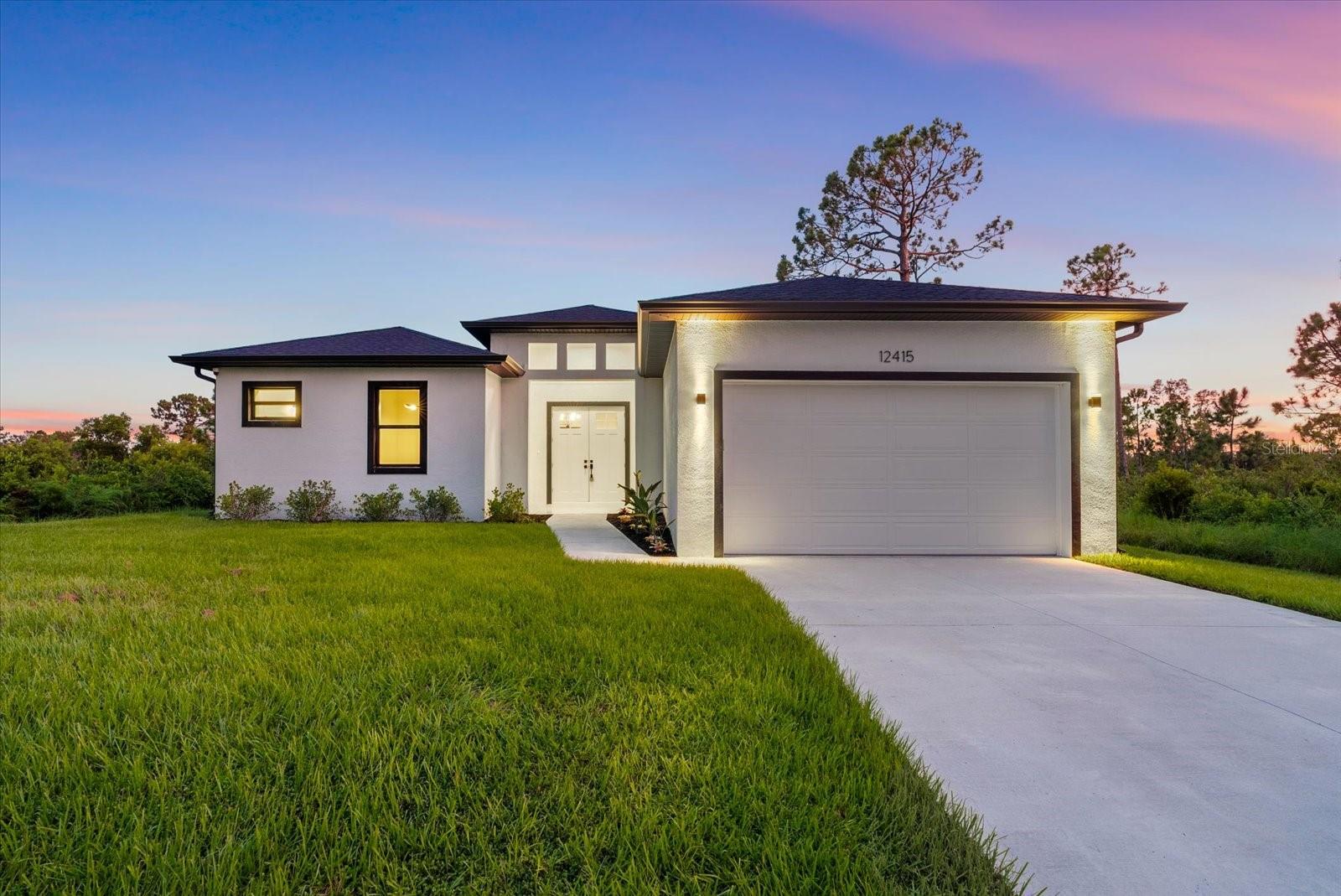 Welcome to your Florida dream home! This gorgeous newly built 3-bedroom, 2-bathroom residence is perfectly situated on a quiet street surrounded by other newer homes, offering peace, privacy, and modern luxury. Inside, you’ll find a spacious open layout with high ceilings, elegant tile flooring, custom LED lighting, and stunning fixtures throughout. The show-stopping kitchen features stainless steel appliances, custom cabinetry, and a waterfall quartz island—ideal for both entertaining and everyday living. The luxurious primary suite offers private pool access, a large walk-in closet, and a spa-inspired en-suite with a soaking tub and walk-in shower. Enjoy the comfort of an indoor laundry room and a polished epoxy-finished garage. Step outside to a private screened-in pool, covered patio, and built-in outdoor shower, all surrounded by lush landscaping and maintained by an irrigation system. With no HOA or lease restrictions and just minutes from Wellen Park, Gulf beaches, shopping, dining, and golf, this move-in-ready home is the perfect blend of style, comfort, and location—schedule your private showing today!