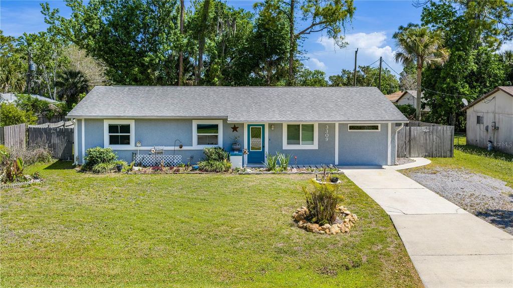 Photo of 3309 Woodland Drive, Edgewater, FL 32141 (MLS # FC317473)