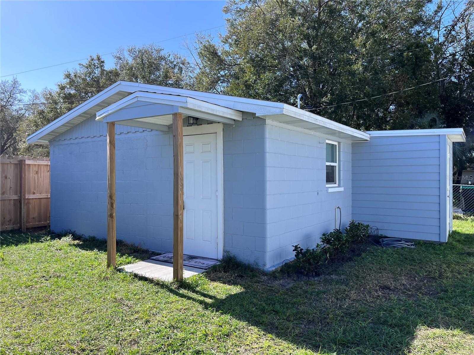 Tiny House. Solid block, 1 bedroom, 1 bath home with 360SF of living space. This home was recently remodeled. It features 12 x 24 tile floors, granite counters in kitchen, stainless steel appliances, updated kitchen and bath cabinets with hardware, new split mini AC system w/ heat, updated light fixtures, ceiling fans, doors, electrical and plumbing and more. It has an electric hot water heater, tongue and groove stained wood ceilings, window blinds, perimeter fencing, recently replaced roof and exterior laundry room. This home is also located right in the middle of town and conveniently located to all the necessities. No HOA. Access house from alley. Hurry!