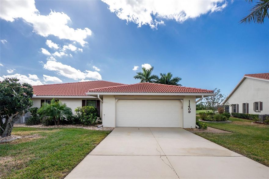 Experience the relaxed Florida lifestyle in this spacious 2-bedroom, 2-bathroom villa located in the sought-after Kingsway Golf Villas community. Offering a perfect blend of comfort and convenience, this home features an expansive floor plan that stands out as one of the most generous layouts in the area.

Chef’s Dream Kitchen
The heart of this home is a custom-designed kitchen built for both organization and style. It features:

Premium Finishes: Gleaming granite countertops and unique cabinetry topped with elegant crown molding.

Smart Storage: Functional sliding drawers, lazy Susans, and a built-in desk area.

Spa-Like Retreats
Both bathrooms have been thoughtfully updated to provide a luxury experience:

Master Suite Remodel: Includes a massive amount of integrated storage and beautiful, high-end cabinetry.

Guest Bath: Designed for comfort and accessibility, featuring a seated tub/shower with jet features for easy maneuvering and relaxation.

Unrivaled Views & Entertaining
The living space extends into a stunning rear sunroom, complete with a mini-bar, fridge, and dedicated ice maker. From here, or from the unique patio surrounded by lush, professional landscaping, you can enjoy what is arguably the best view in the community—a picturesque panorama of rolling golf greens and serene water.

Property Highlights:
Prime Location: Situated in the quiet enclave of Lake Suzy, providing a serene atmosphere while remaining close to shopping, dining, and Interstate 75.

Maintenance-Free Living: Enjoy access to a refreshing community pool without the upkeep of a private one.

Peace of Mind: Located in Flood Zone X, which typically does not require federal flood insurance.

Pet Friendly: Bring your furry companions along (size limits apply).