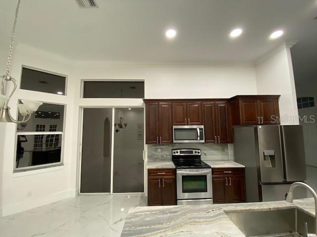 Photo of 26 NW 8th Pl, Cape Coral, FL 33993 (MLS # N6143763)