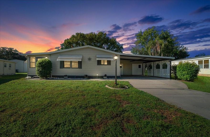 NO BOND! ~ ROOF 2025 ~ HVAC 2025 ~ HOT WATER TANK 2025 ~ BEAUTIFULLY UPDATED ~TURNKEY~ 2 bed/ 2 bath manufactured home in the HISTORIC Village of Orange Blossom—just minutes to Spanish Springs!

Welcome to this tastefully updated home offering comfort, style, and convenience in one of the most desirable areas of The Villages. Situated on a spacious lot with mature landscaping, this home delivers the charm of the historic side with modern upgrades throughout.

Step inside to find a bright and inviting layout featuring LUXURY VINYL PLANK flooring in the main living areas and FRESH CARPET in the bedrooms for added comfort. The beautifully renovated kitchen showcases WHITE QUARTZ countertops, WHITE CABINETRY, and a STYLISH TILE BACKSPLASH, creating a fresh and modern space perfect for cooking and entertaining.

The guest bathroom adds a fun pop of personality with its CHEERFUL COASTAL BLUE design, complete with a tub/shower combo, GRANITE countertops, and TILE BACKSPLASH. The spacious primary suite features DOUBLE DOOR entry, CEILING FAN, and a private en-suite bath with an UPDATED WALK-IN SHOWER, GRANITE countertops, and TILE BACKSPLASH.

Enjoy the best of Florida living with a versatile FLORIDA ROOM that seamlessly connects to both the living room and the lanai through GLASS SLIDERS, creating the perfect flow for relaxing or entertaining year-round.

Additional features include fresh interior and exterior paint, a DOUBLE CAR CARPORT, GOLF CART GARAGE, and a convenient laundry and storage area—ideal for everyday ease and extra functionality.

Located just a short golf cart ride to Spanish Springs Town Square, you’ll enjoy nightly entertainment, shopping, dining, and close proximity to Orange Blossom Hills Country Club, Hilltop Pool, and nearby golf courses and recreation centers.

This home offers the perfect combination of UPDATED STYLE, PRIME LOCATION, and NO BOND, and OPTIONAL TURNKEY PACKAGE —making it an excellent choice for full-time living, a seasonal retreat, or investment opportunity. Be sure to watch the VIRTUAL TOUR and book your showing to see this beautiful move-in ready home today!!!