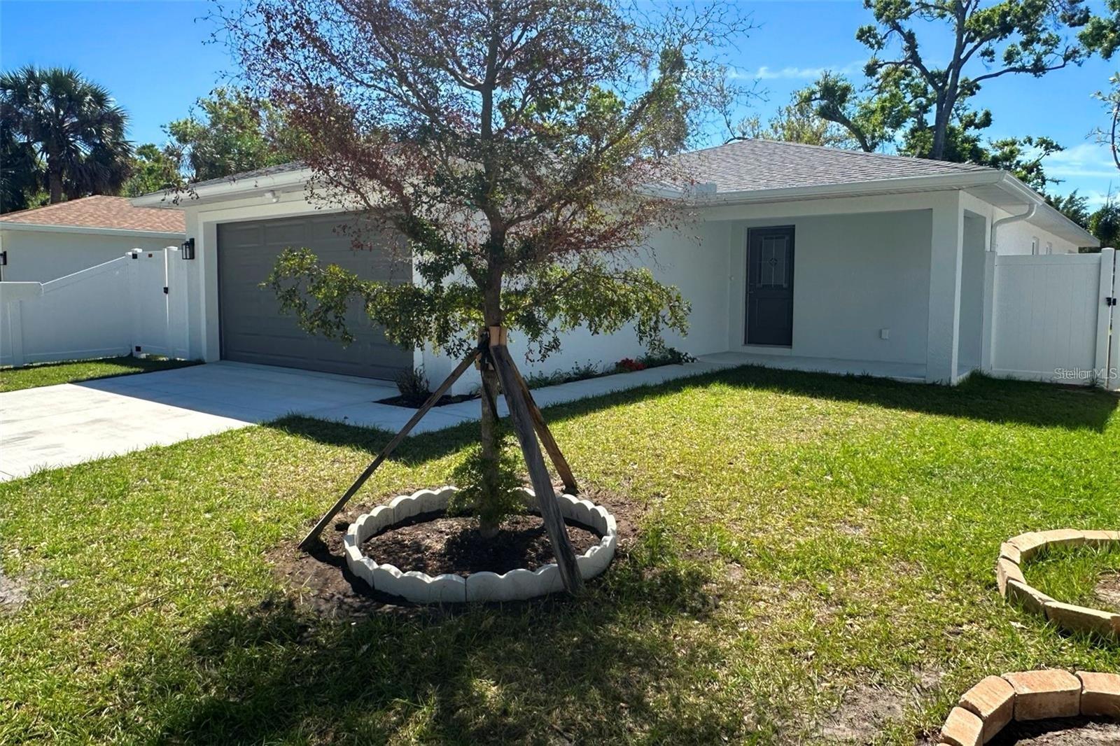 Amazing New Construction property/s in Sarasota’s thriving historic Central Cocoanut neighborhood! This brand-new home offers the perfect fusion of modern design, comfort, and convenience, just 3-4 minutes from downtown Sarasota and the city’s top attractions. Step inside the spacious 1,380 sq. ft. of beautifully designed living space, featuring high ceilings, canned lighting, three large bedrooms and two stylish bathrooms. High ceilings and luxury vinyl plank flooring create an open, airy ambiance, while large high impact hurricane grade windows all around, invites in loads of natural light while at the same time keeping the interior whisper quiet. The property itself is also a full 22 ft above sea level, bringing even more peach of mind. The thoughtfully designed open floor plan is ideal for both entertaining and everyday living. The spacious two car garage ensures that both of your vehicles are pampered, plus there is space in the driveway if another vehicle needs to be parked. The heart of the home is the gourmet kitchen, where high-end stainless-steel appliances, solid wood soft close cabinetry, quartz countertops, and a charming breakfast bar come together with both style and functionality. Each bedroom provides a private retreat, and the spa-inspired bathrooms boast elegant tiled showers and brushed aluminum finishes. You and your best pets will fully enjoy your covered back lanai and fenced yard, a perfect spot for relaxation, entertaining and allowing your best friend to run and enjoy. This home is built with extreme quality in mind and includes energy-efficient appliances and enhanced attic ventilation for year-round comfort. A Trane AC keeps the interior very comfortable, while a Trane water heater takes care of the water. Add to that, with no HOA, CDD fees, nor deed restrictions you have the freedom to fully enjoy your property. Access to the attic from the garage allows for additional storage space, as to the massive closets in each of the bedrooms. Located just minutes from St. Armands Circle, Sarasota Military Academy, Van Wezel Performing Arts Hall, Ringling College of Art and Design, Bayfront Park, and Sarasota’s world-famous beaches, this home is an incredible opportunity to own a brand-new residence in the rapidly growing Historical Central Cocoanut community. Seeing that its an easy car, bike or scooter ride downtown, or the quickly approaching Bay Project, you are guaranteed not to miss any of the activities downtown Sarasota provides, and never have to worry about downtown parking.