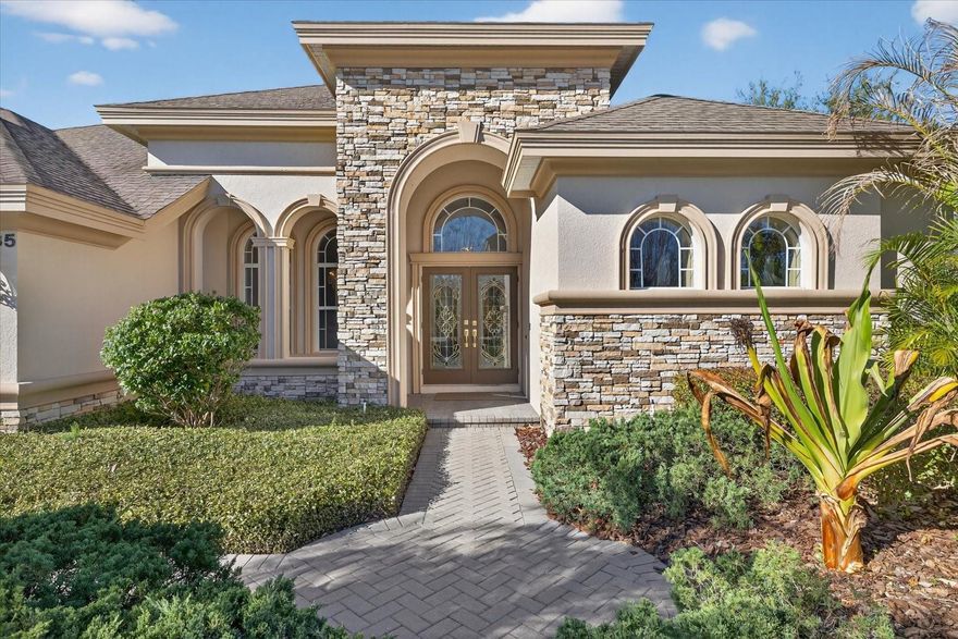 Welcome to Winslow Park, a private gated enclave in Tarpon Springs known for its quiet streets, beautiful homes, and proximity to some of the area’s best lifestyle amenities. This elegant 5 bedroom, 4 bath pool home offers nearly 3,200 square feet of thoughtfully designed living space, blending comfort, space, and effortless indoor outdoor living.

From the moment you arrive, the home impresses with its stone accented architecture, grand double door entry, and bright open layout filled with natural light. The spacious kitchen sits at the heart of the home and features granite countertops, wood cabinetry, stainless steel appliances, and a large center island perfect for entertaining or everyday living.

The expansive primary suite serves as a private retreat with direct access to the outdoor patio and a luxurious bath featuring a soaking tub, walk in shower, dual vanities, and generous closet space. Additional bedrooms are well positioned throughout the home, including an upper level suite ideal for guests, a media room, or a private office.

Step outside to your screened resort style pool and spa, surrounded by a spacious paver deck and covered lanai that creates an inviting setting for relaxing or hosting gatherings year round. The outdoor living area offers plenty of space for lounging, dining, and enjoying Florida’s year round outdoor lifestyle.

Located just across from Crescent Oaks Country Club, Winslow Park offers the charm of a quiet gated neighborhood while being minutes from Tarpon Springs’ historic Sponge Docks, local marinas, restaurants, shopping, and Gulf beaches. Convenient access to major roadways makes commuting to Tampa and surrounding areas easy.

This is a rare opportunity to own a spacious pool home in one of Tarpon Springs’ desirable gated communities.