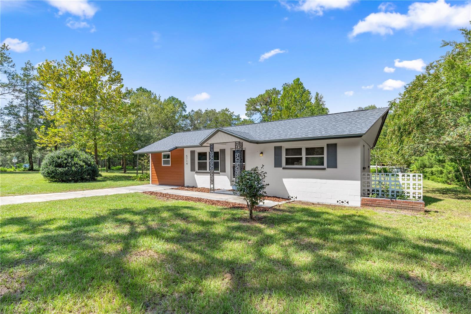 Available NOW! Very PRIVATE Annual Unfurnished Pet-Friendly Rental! This nearly ONE FULL ACRE residential CORNER LOT surrounded by PINES and CEDARS has endless possibilities - plenty of room for your BOAT, RV, and GOLF CART! Move right in this charming 3 BEDROOM home and rest confidently knowing the AC and ROOF are both BRAND NEW. This modern-finished country home retains its original character with stunning OAK FLOORS throughout most of the home complemented by CEDAR CLOSETS, and BUTCHER BLOCK COUNTERTOPS. Light and bright - the large SUNROOM allows light to pour in from nearly all directions. The INSIDE UTILITY provides a comfortable space for storage and the WASHER /DRYER are INCLUDED! Enjoy drifting down the CRYSTAL CLEAR WATERS of RAINBOW RIVER or camping at RAINBOW SPRINGS State Park, both just minutes down the road for exceptional KAYAKING and BOATING. WORLD EQUESTRIAN CENTER is just about 15 minutes' drive and about 25 minutes to I-75 and Ocala! Plenty of shopping in town. Enjoy WATERFRONT DINING in downtown Dunnellon - Swampy's and Blue Gator are just minutes from home! Additional background, turnover, and pet charges apply.