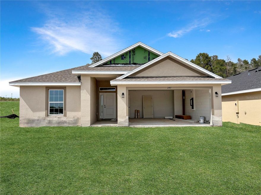 Under Construction. Take advantage of exceptional Adams Homes incentives, including only $1,000 down to secure your contract, closing costs paid with the preferred lender, and $10,000 in flex cash to buy down your interest rate, cover prepaids, or reduce the purchase price. Plus, enjoy peace of mind with a 10-year structural warranty. Step inside this beautiful new construction home in Arbor Park, where a bright, open-concept layout creates a seamless flow between the great room, dining area, and kitchen. At the heart of the home, the kitchen features a large island, modern finishes, a walk-in pantry, and ample cabinetry, making it the perfect space for both entertaining and everyday living. The private primary suite is thoughtfully tucked away and offers a spacious layout with a large walk-in closet and a well-appointed bath with dual vanities. The split-bedroom design provides added privacy, with secondary bedrooms located on the opposite side of the home. Additional highlights include a generously sized separate laundry room and a covered patio/lanai just off the great room, ideal for enjoying Florida living year-round.