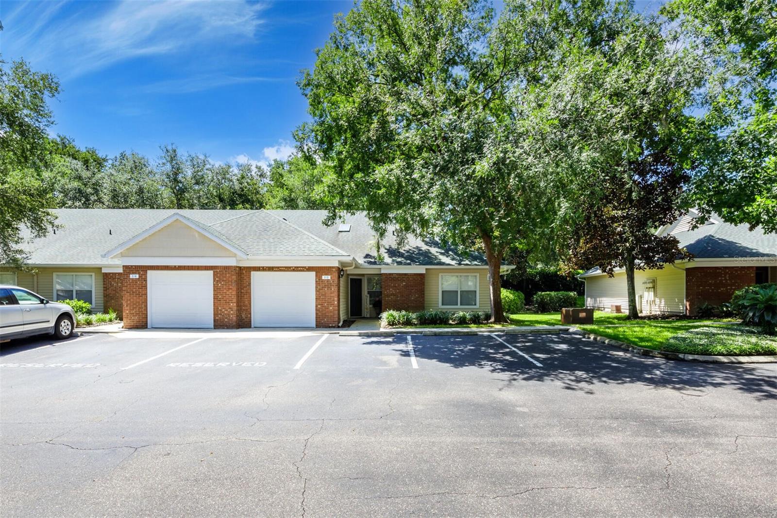 Welcome to The Greens at West End—Alachua County's premier gated condominium community located in the heart of the desirable Jonesville area, just minutes from Tioga Town Center, shopping, dining, and more. This impeccably maintained community offers a rare combination of privacy, security, and resort-style amenities, including a clubhouse, pool and spa, fitness center with sauna, two lighted tennis courts, half basketball/pickleball court, dog run, playground, and car wash stations. Plus, enjoy the ease of low maintenance living with exterior maintenance and landscaping covered by the HOA.
This beautifully updated condo with a spacious layout begins with a welcoming foyer that leads into a bright, open-concept kitchen featuring ample cabinet and counter space. The adjacent dining area flows seamlessly into a large living space, ideal for relaxing or entertaining, and opens to a private, screened-in patio.
Updates include:
2020: New roof and skylight, water heater, stove, dishwasher, microwave, and ceiling fans
2023: New A/C unit and Wi-Fi-enabled thermostat
2023–2024 Guest Bathroom Upgrades: New toilet, vanity, sink, upgraded fixtures, and backsplash
2020–2024 Primary Bathroom Enhancements: New shower, upgraded toilet, sink, backsplash, mirror, and lighting.
Centrally located just minutes from I-75 and the University of Florida, and less than 5 minutes from Publix, Starbucks, and many of the area’s favorite restaurants and shops. This move-in ready home blends modern upgrades with comfort and lifestyle convenience—don't miss your chance to make it yours!
