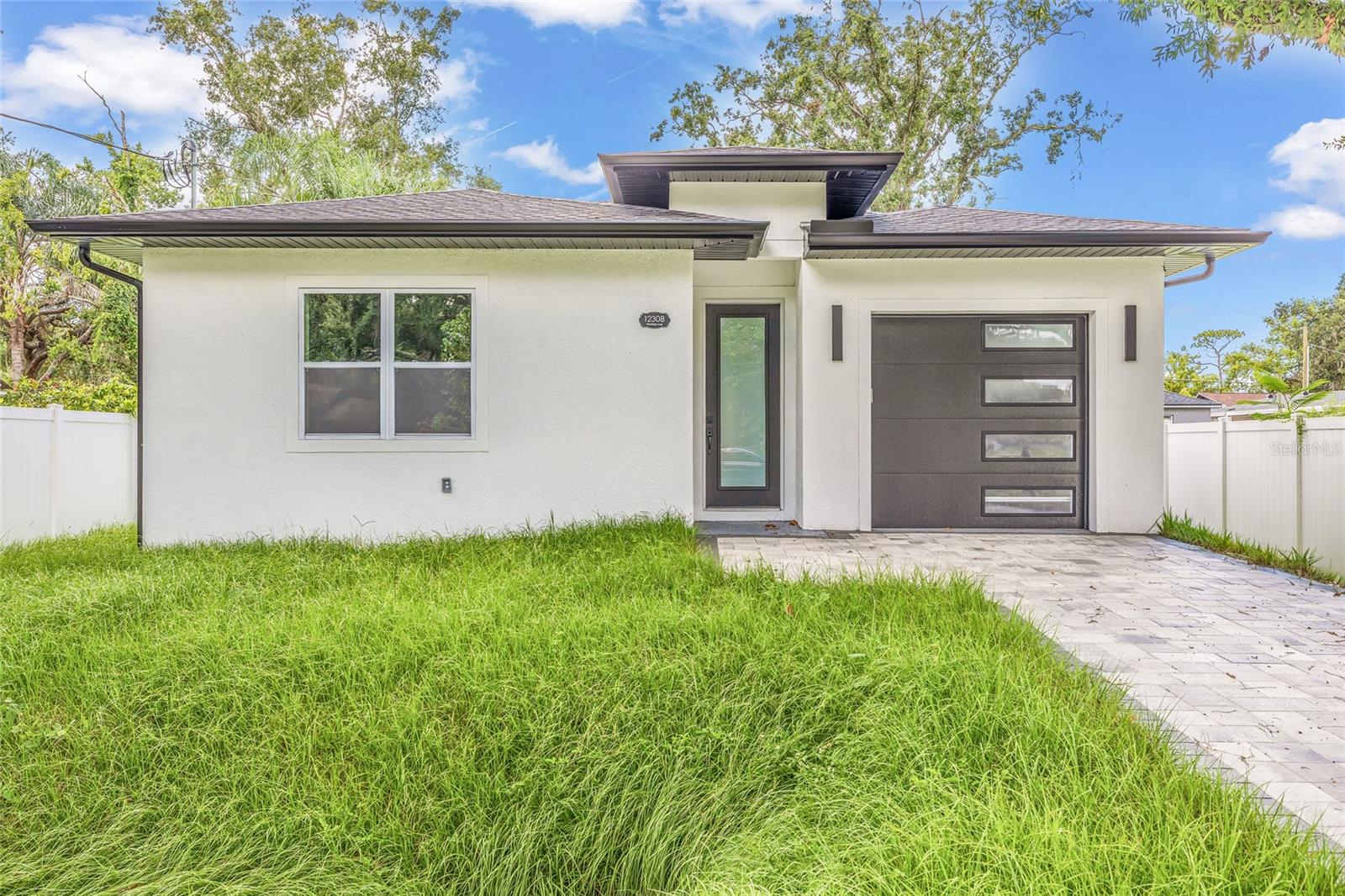 Be the First to Own This Gorgeous New Construction Home in Carrollwood! Step into luxury with this beautifully crafted 3-bedroom, 2-bath residence offering 1,991 square feet of thoughtfully designed living space. Nestled in one of Carrollwood’s neighborhoods, this brand-new home showcases high-end finishes, an open-concept layout, and modern style throughout. Enjoy spacious bedrooms, a sleek gourmet kitchen, and elegant bathrooms—all just minutes from shopping, dining, parks, and top-rated schools. With its unbeatable location and attention to detail, this home perfectly blends comfort, convenience, and contemporary living. Don't miss this rare opportunity—schedule your private showing today!