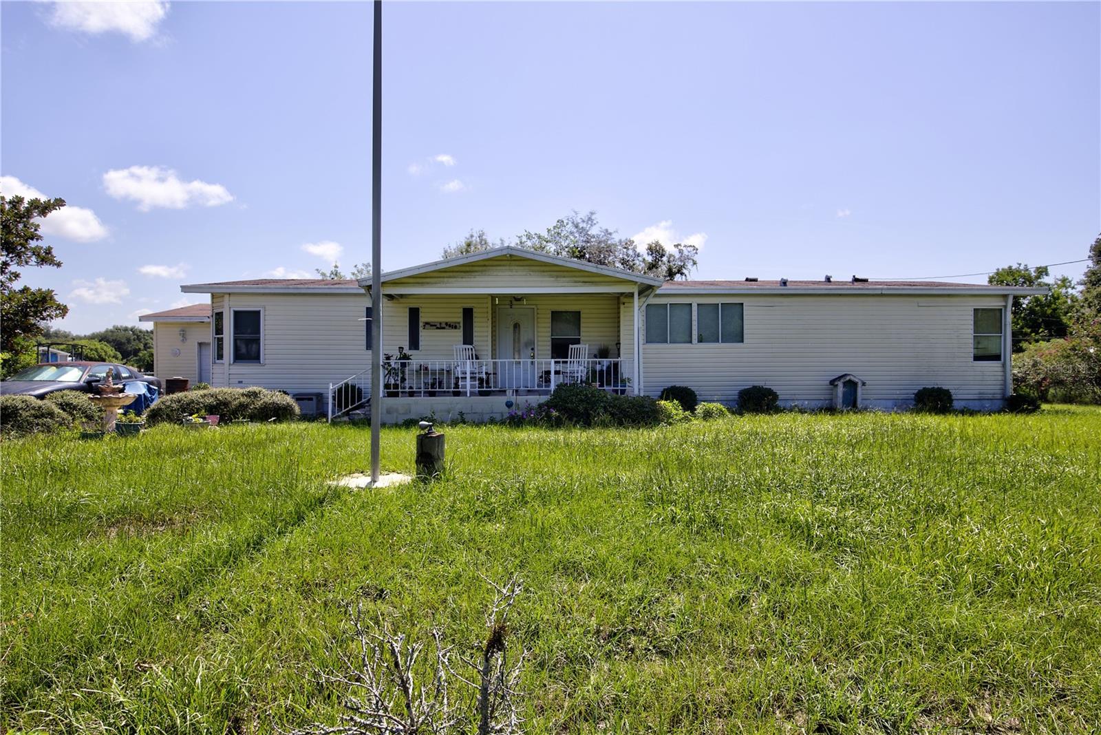Welcome to this cute country living home on a generously .52 acres in Dade City. It has 3 Bedrooms, 2 Full Bathrooms, bonus room and an oversized garage. When you enter this home, you will fall in love with the living room size. The kitchen opens up to the dining room and living room. All the appliances in the kitchen stays with the home (fridge, built in oven, cook top and dishwasher). The kitchen has lots of room with a kitchen island. The bedrooms are a split floor plan. On one side of the house, you have 2 bedrooms and 1 full bathroom. The other side of the home is your primary bedroom which is big enough for a king size bed. Plus, the primary bedroom has an additional bonus room attached to the room. You can use this room for a large extra closet, extra living room, office, exercise room etc. Your ensuite has tub and separate shower. Other features this over 1800 sq ft home has: fireplace in living room, laundry room is inside, laundry room has extra storage pantry and cabinets, built in intercom stereo, garage is oversized for a workshop. Heading outside you will enjoy your large yard that is fenced with a gate, paved driveway, front porch, shed to store all your lawn equipment (or for extra storage), side yard patio and a back patio. No HOA and No CDD. This home provides the perfect balance of country scenery and a quick grocery run for a last-minute dinner (check out a map to see how close you’re to shopping in Dade City or Zephyrhills. Also, not too far to go to Lakeland or Wesley Chapel. For more entertainment this home is a little north right between Orlando and Tampa). Make your appointment today to view this house and put a contract together to make this excellent home and property yours.