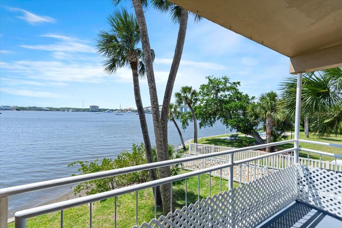 Completely remodeled, water front, end unit in the desirable complex of Acqua at Daytona Beach. This 2 bedroom 2 full bathroom unit is one of the few with a waterfront balcony! Kitchen has been opened up for larger water views with all new appliances, counter tops, faucet & cabinets. An oversize island has been added with additional storage on each side and bar seating. Living area has new LED light changing walls. Luxury vinyl flooring throughout. 2 modern asymmetric walls added to living area and master bedroom. Master bedroom has waterfront views with tv wall mount. Master Bathroom & guest bathroom both have shower/tub with updated shower, vanity, counters, & cabinets. The views are unbelievable from this riverfront end unit. There is so much natural lighting and it has breathtaking sunsets. Watch the dolphins play and the boats go by all day long. Close to shopping, downtown, restaurants, bars, marina & LESS THAN A MILE FROM THE WORLD FAMOUS DAYTONA BEACH! Get in while you can!