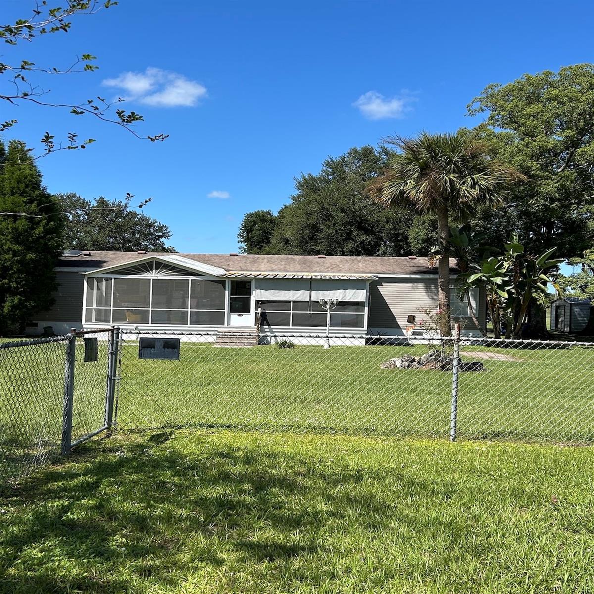 Room to spread out and relax on your own fenced 1-acre lot in Plant City! This 1,700 sq ft, 3-bedroom, 2-bath mobile home has a roof that’s only 5 years old. Step outside to your own backyard retreat with a sparkling pool, spacious deck, and a screened patio with ceiling fans—perfect for relaxing or entertaining year-round. Two garages give you plenty of space for storage, hobbies, or projects. This property offers the comfort of a well-kept home along with the freedom of extra space—just minutes from town but with the privacy you want. Don’t miss this unique opportunity in Plant City!