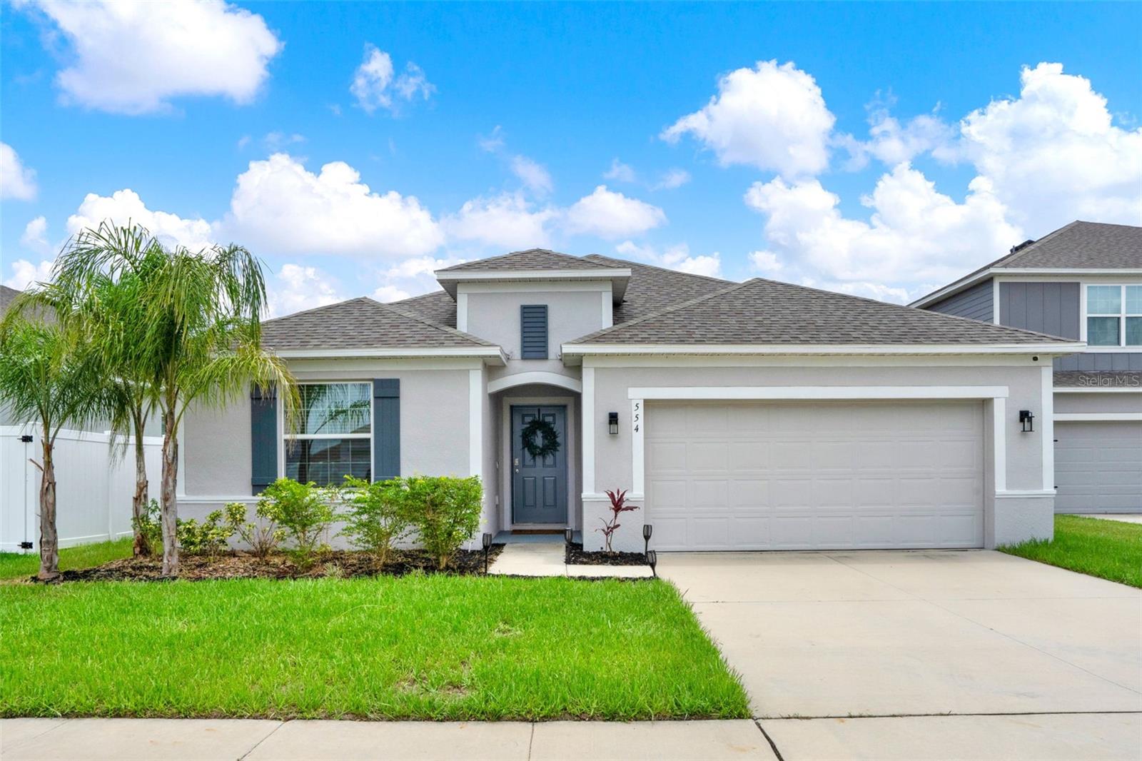 Beautiful Move-In Ready Almost-New Single Story Home, Built in 2023 in the community of Calabay Crossing... 4 bedrooms, 2 Bathrooms, 2,182 sq ft of Open-Concept living. Designed with a desirable 3-way split floor plan... Wide Entry Foyer with tray ceiling, large ceramic tile flooring in main living areas, and plush carpet in the bedrooms. Ceiling fans are thoughtfully placed throughout the home and in the screened outdoor lanai (excluding the first bedroom).
As you enter through the Foyer, to the left you will be greeted by Two Bedrooms and a Full Bathroom complete with a sizable Linen Closet, & to the right you have a Laundry Room and a Third bedroom—Perfect for Guests or a Home Office.
At the heart of the home sits a Massive Oversized Kitchen Island with plenty of light grey cabinetry, island seating and counter space. The kitchen flows seamlessly into the Dining Room and Expansive Living Room, Framed by 3 Sliding Glass Doors that open to a tranquil Screened-In Back Porch perfect for entertaining... creating a comfortable Indoor-Outdoor Lifestyle.
The Private Primary Suite is tucked away towards the back of the home including a Large Walk-In Closet and a Spa-Like Bathroom complete with a Linen Closet for extra storage, Water Closet, Double Sinks separated by a Make-up/Vanity area, Huge Mirror and a Stunning Floor-to-Ceiling Tiled Shower and Soaking Tub.
This home is located in a very fast growing area ... Near tons of shopping, dining, major roadways, major theme-parks and beaches! This gorgeous home is a must-see. Schedule your private showing today!