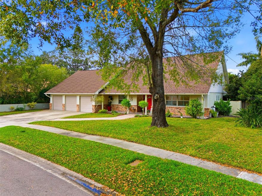 Welcome to 5026 Barrowe Drive, a one-of-a-kind residence nestled in the heart of Carrollwood! One of Tampa’s most established and sought-after neighborhoods, surrounded by golf courses, tennis courts, parks, and everyday conveniences. This artfully styled, character-rich home offers 3,364 square feet of thoughtfully designed living space, featuring 4 bedrooms, 2.5 bathrooms, a 3-car garage, and 2 expansive bonus rooms—providing exceptional flexibility for today’s modern lifestyle. The primary suite is conveniently located on the first floor, creating a private retreat complete with sliding glass doors leading directly to the heated saltwater pool and spa. The spa-like ensuite bathroom includes a walk-in shower, separate soaking tub, and a built-in sauna, offering a true resort-at-home experience. The main living areas are filled with natural light and architectural interest, highlighted by a two-story vaulted family room with abundant windows, creating an open, airy feel throughout the home. Also on the main level, you’ll find a dedicated dining room, a kitchen with white cabinetry and granite countertops (classic and well-maintained), and an office surrounded by windows overlooking the lush garden, perfect for working from home. A half bathroom for guests, laundry room with lots of storage, and a large bonus room on the first floor, currently used as a bedroom, adds even more versatility. Upstairs, the home continues to impress with three generously sized bedrooms, a loft area overlooking the family room, and a full bathroom with dual vanity sinks, ideal for family living. Recent updates include a newer roof (approximately 2 years old), newer A/C, and updated double-pane windows and sliding glass doors, ensuring comfort and efficiency. What truly sets this property apart is the over-the-top lush landscaping in the backyard. An entertainer’s dream and private oasis featuring mature fruit trees, vibrant greenery, and a heated saltwater swimming pool and spa, perfect for year-round enjoyment. With its artistic charm, flexible layout (including multiple bonus rooms that can easily function as offices, dens, or additional sleeping spaces), and prime Carrollwood location, this home seamlessly blends character, comfort, and functionality, making it an exceptional opportunity for families and creatives alike.