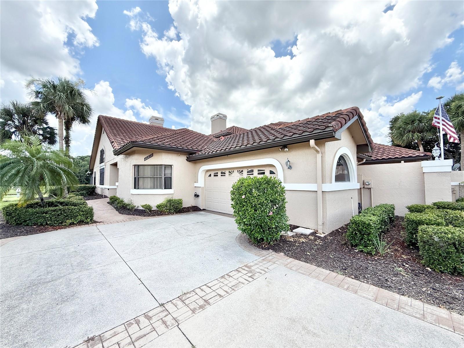 Discover your golf and lakefront oasis at Bishops Gate! This fully furnished two-bedroom townhouse offers prime views of the golf course and serene lake from the family room, living room, and spacious lanai. Entertain with ease in the open layout, featuring cathedral ceilings and a fireplace. The primary bedroom boasts stunning views, while the well-maintained home, used seasonally, awaits your personal touch. Enjoy resort-style living with a tiled roof and a 2-car side entry garage. Embrace an active lifestyle—schedule your viewing today! For just $275/month HOA, relish free golf and weekday lunches(not guaranteed to continue), and lawn care. Gated entrance, pool, tennis, pickleball, soccer, and a marina (extra $100/month) on the Chain of Lakes. Stay active at the fitness center for a nominal $30/month. Live the resort life daily – perfect for full-time living or a part-time escape. Don't miss the chance to make this townhome your dream retreat. Schedule your viewing now and start living the dream!