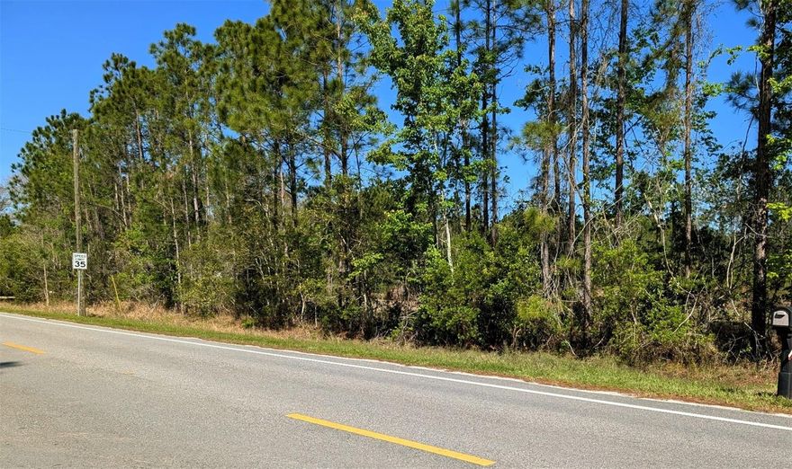Discover the perfect blend of privacy, natural beauty, and ready-to-build potential on this stunning 2.55-acre parcel in Daytona North Subdivision of Bunnell. The majority of the land has already been cleared and thoughtfully built up with fill, offering a head start for your future home or investment. Mature trees gracefully line the property boundaries, providing both shade and seclusion, while a picturesque 33-foot-deep spring-fed lake sits peacefully at the rear—creating a serene backdrop and a true connection to nature. Known for great fishing, this private lake is perfect for casting a line right from your own property or enjoying a quiet afternoon in a small jon boat. 
Imagine waking up to the sounds of birds, rustling leaves, and pure tranquility- this is real country living located in a quiet location with minimal traffic. There is  a culvert already in place at the front entrance for easy access, adding to the property's convenience and usability. Zoned MH-1, this property offers flexibility for mobile or manufactured homes, as well as the opportunity to build your own home and create a private homestead-style retreat. With ample space for gardening, outdoor living, and animals, you can truly design the lifestyle you’ve been dreaming of. If you're looking for space, peace, and natural charm—this property delivers it all!