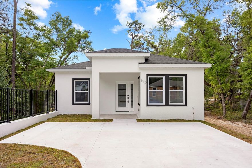One or more photo(s) has been virtually staged. One or more photo(s) has been virtually staged. BRAND NEW & MOVE-IN READY Welcome to this stunning modern Florida style home in the heart of Deland—no HOA, no CDD, and NOT in a flood zone! This beautifully built 3-bedroom, 2-bath home features 1,363 sq ft of smart living space, a split floor plan, and gorgeous finishes throughout. Enjoy the bright open layout with soaring ceilings, dedicated dining space, and a spacious kitchen complete with stainless steel refrigerator, over-the-range microwave, and included water heater. The primary suite is tucked away for privacy and features a large walk-in closet and a stylish end-suite bath. Generous guest bedrooms, oversized closets, a laundry space, and rear patio.