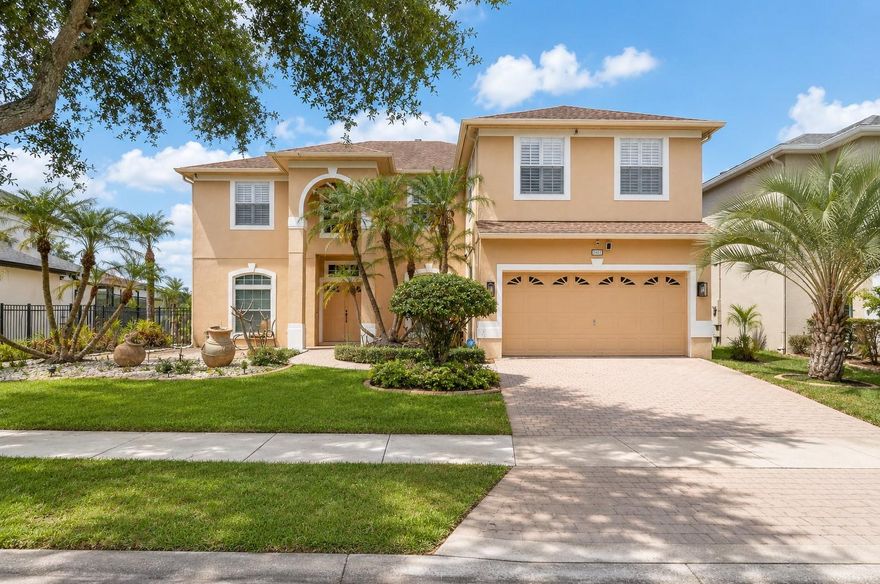 Welcome to this stunning two-story home that perfectly blends elegance, comfort, and modern upgrades. Featuring 5 spacious bedrooms and 3 full bathrooms, this beautifully maintained residence offers an ideal layout for both everyday living and entertaining.
From the moment you step inside, you’ll be impressed by the open and inviting floor plan, featuring a formal living room, formal dining room, and a generous family room designed for gathering and relaxation. The main living areas are bright and airy, with large sliding glass doors that frame beautiful views of the screened pool and lanai, creating the perfect indoor-outdoor living experience.
The first floor includes a private bedroom and full bathroom, ideal for guests, extended family, or a comfortable in-law suite. Upstairs, a large bonus room with a closet offers incredible flexibility and can easily serve as a home office, media room, playroom, or even an additional bedroom.
At the heart of the home is the beautifully upgraded kitchen featuring custom 42-inch cabinetry, granite countertops, stylish backsplash, stainless steel appliances, range hood, wine cooler, and a cozy breakfast nook. A large breakfast bar with seating for up to four stools makes this space perfect for casual dining and entertaining.
Step outside to your own private backyard oasis, complete with a sparkling pool and jacuzzi surrounded by an oversized deck and a rare two-story screened enclosure—an exceptional feature rarely found and designed for year-round outdoor enjoyment. Relax while taking in peaceful pond views with no rear neighbors, all enclosed by an elegant iron fence for added privacy.
Upstairs, engineered wood flooring flows throughout, complemented by beautifully finished staircases, while the first floor features durable ceramic tile with no carpet anywhere in the home. Additional upgrades include crown molding, upgraded baseboards, and California shutters throughout.
The luxurious primary suite has been tastefully updated and features a spa-inspired bathroom with travertine finishes, frameless glass shower enclosure, shower niche, dual sinks, updated cabinetry, and modern mirrors. The secondary bathroom has also been upgraded with a frameless glass shower and designer tile finishes.
Major updates provide peace of mind, including a roof replaced in 2018, water heater replaced in 2024, new garbage disposal, Pentair IntelliFlo pool pump, front windows etc. Additional highlights include a private balcony with breathtaking views, a two-car garage, and a dedicated electric vehicle charging plug.
Recently painted and meticulously maintained, this move-in-ready home offers a rare combination of luxury, functionality, and exceptional outdoor living. The property remained high and dry during recent major storms. The spacious laundry room is also pre-plumbed for a future utility sink.
Ideally located, this home offers convenient access to Vista Lakes amenities, including a resort-style pool complex, lap pool, pirate ship water playground, parks, and scenic lakefront walking trails. The location also provides easy access to Lake Nona Medical City, Orlando International Airport (MCO), major highways including 417 and 528, as well as excellent shopping and dining options.