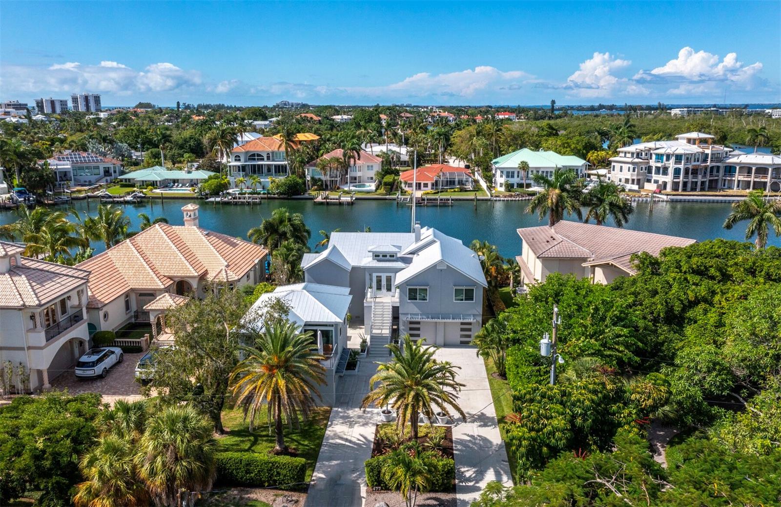 Waterfront, 1939 built and remodeled to perfection, including the addition of casita over additional garage. 75' of seawall and a 324' wide natural basin, gorgeous views to the bay and downtown Sarasota. Pool, deep water boat docks, lift. Privacy abounds with natural preserve across the street. Walk to the beach and St. Armands. This is the quintessential Sarasota lifestyle!
