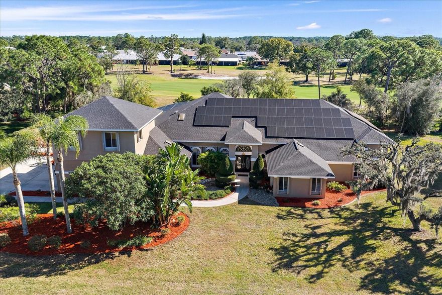 Stunning custom estate set directly on the golf course in the highly desirable Sun ‘n Lake community of Sebring. Positioned on an oversized 0.70-acre lot, this impressive two-story residence offers over 5,900 sq ft of heated living space and more than 8,500 sq ft under roof, seamlessly combining luxury, comfort, and everyday functionality. The home also features a seller-owned solar system (no lease), providing energy efficiency and long-term savings.
This 5-bedroom, 4.5-bath home showcases an open, airy floor plan with soaring vaulted ceilings, skylights, and beautiful wood and tile flooring throughout. The chef’s kitchen is thoughtfully designed with stone countertops, built-in and convection ovens, cooktop, wine refrigerator, trash compactor, and abundant prep and storage space—ideal for entertaining. Multiple living and dining areas, a wet bar, and a central vacuum system further enhance convenience and appeal.
The primary suite, located on the main level, serves as a private retreat with walk-in closets and tranquil views. Additional bedrooms PROVIDEgenerous space for family, guests, or home offices.
Outdoor living truly shines with a heated in-ground pool, outdoor kitchen, outdoor shower, private yard, garden areas, and picturesque golf course views—perfect for relaxing or hosting year-round. Additional features include hurricane shutters, whole-home generator, irrigation system with well, ample storage, balcony, private entrance, and a 2-car attached garage.
Located within a deed-restricted golf community offering optional amenities such as a fitness center and community pool, with a remarkably low annual HOA of just $25. Conveniently close to shopping, dining, medical facilities, and recreation. A rare opportunity to own a luxury golf-course estate offering space, privacy, resort-style living, and the added benefit of an owned solar energy system.