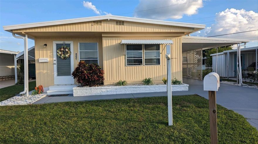 Welcome to this cozy, land-owned mobile home in the desirable 55+ community of Tidevue Estates, offering a peaceful coastal lifestyle with an active and social atmosphere. The home features a desirable open layout connecting the living and dining areas, complemented by an updated kitchen and laminate flooring throughout the main living spaces. The primary bedroom includes an en-suite bathroom featuring a tub/shower combination and a modern vanity.
A bright Florida room with ceramic tile flooring, abundant windows, and a convenient laundry area provides the perfect space to relax or entertain. Additional features include a double-length carport with an attached workshop shed, ideal for hobbies or shaded outdoor enjoyment. Recent updates include a freshly painted exterior and driveway, new carpeting in the bedrooms, and a professionally cleaned interior. Conveniently located near I-75, just minutes from Ellenton Outlet Mall, shopping, dining, the Manatee River, and approximately 8–10 miles from Gulf beaches. The nearest hospital is just 3 miles away.
Tidevue Estates offers beautifully maintained grounds and an impressive array of amenities, including a clubhouse, heated swimming pool, pickleball, shuffleboard, and bocce courts. The recreation hall features a library, craft room, exercise room, pool room, and a main hall with stage, along with a full calendar of activities such as cards, dancing, exercise classes, golf, and social clubs. This inviting community truly delivers the best of relaxed and active Florida living.