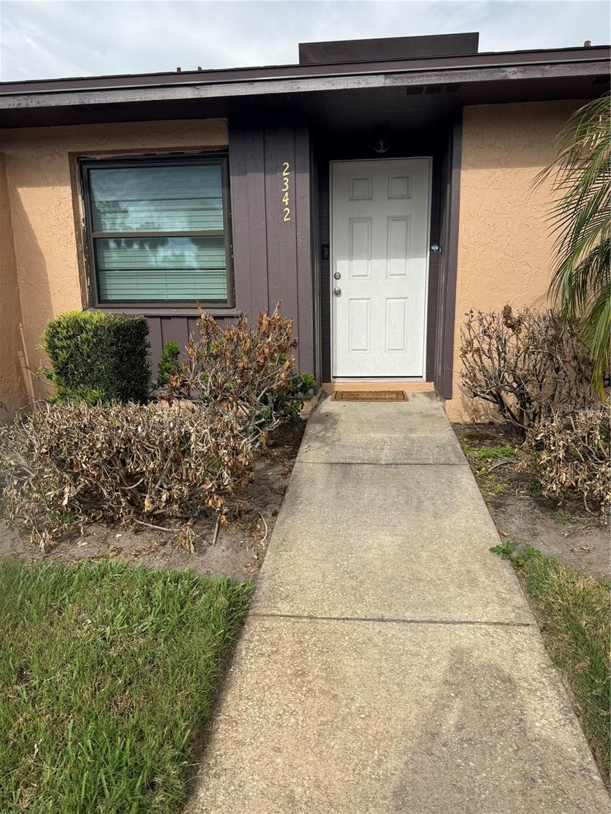 Welcome to this beautiful, completely renovated villa. Location, location, location! This area in downtown Kissimmee is situated close to The Loop Shopping Center, featuring all the best shops and restaurants. It also offers access to top-tier medical care, including hospitals, medical specialists, and excellent healthcare services. This villa has been fully renovated and features stainless steel appliances, granite countertops, a washer and dryer, updated bathrooms, and perfectly coordinated wood flooring. Additionally, it includes two parking spaces directly in front of the property. The community also offers a swimming pool and a recreational area.