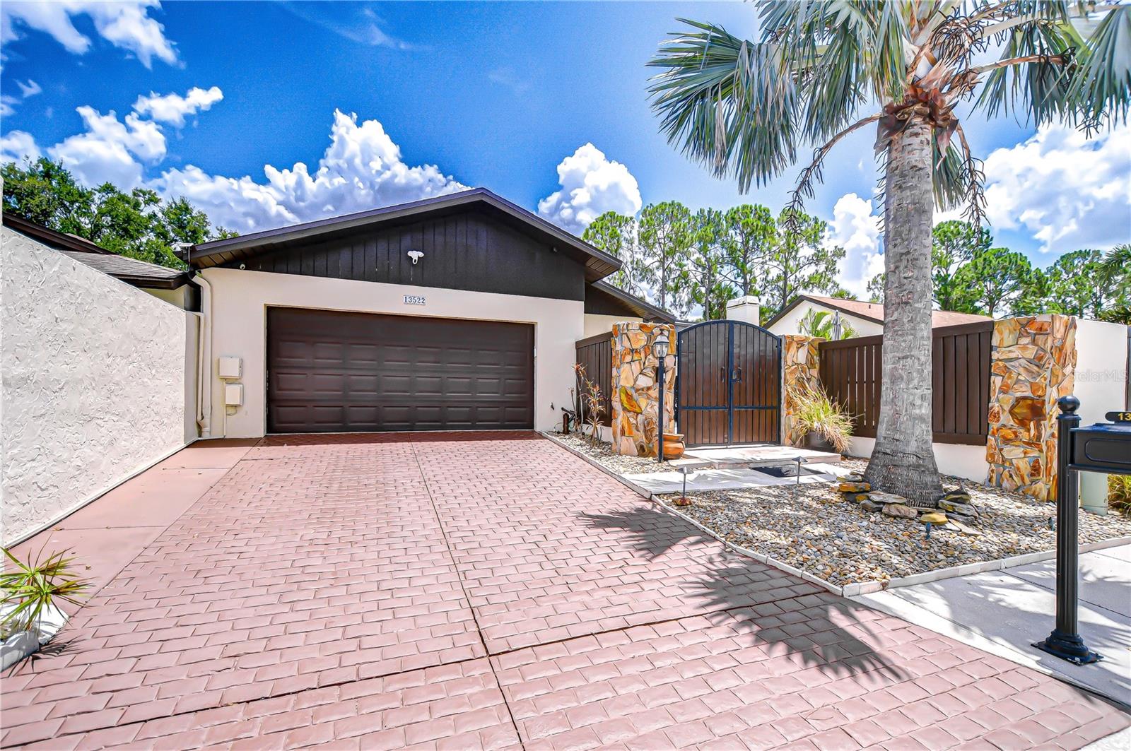 A RARE FIND in the highly sought after AVISTA community of CARROLLWOOD VILLAGE. This meticulously cared for 3 bedroom/2.5 bath pool home has been tastefully updated throughout. Most windows and sliding doors were replaced in 2019 and are hurricane rated with tinted glass. SHINGLE ROOF replaced December 2024; Composite patio roof replaced 2020; NEW Water Heater April 2025; Water softener 2022. This split bedroom floor plan offers a multitude of possibilities depending on your needs. Updated cook's dream kitchen features a Kitchenaid Professional Series gas stove with convection and steam oven, spacious coffee bar, an abundance of storage, stunning granite countertops and spacious dining area. All three bathrooms have also been updated and contemporary tile flooring has been installed throughout. Large interior laundry room has shelving and a utility closet. MOVE RIGHT IN and start enjoying your new lifestyle! Relax in your own private oasis: expansive and covered patio overlooks the large pool that was resurfaced in 2022. Upgraded pool pump and motor replaced in June 2024. Adjacent to the pool deck with pavers is an outdoor fountain and artificial turf for easy maintenance. A/C replaced approx. 2017. Three storage sheds convey. LOW MAINTENANCE yard care with no grass to mow! Avista is located adjacent to Carrollwood Park (see photos) and close by all the amenities offered in Carrollwood Village including tennis, pickleball, basketball courts and playgrounds. Conveniently located to restaurants, shopping and easy access to the Veteran's Expressway. Avista has an annual HOA fee as well as a Carrollwood Village annual master association fee. Various optional memberships are available at the Carrollwood Golf and Country Club.