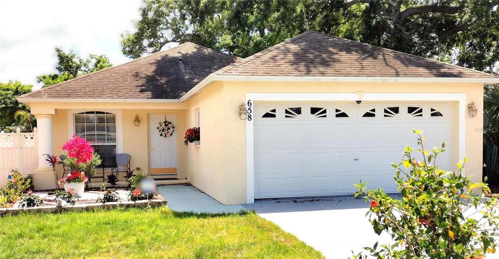 Move-In Ready 3-Bedroom/2-Bath Home/2 Car Garage/Fenced back Yard – Style, Comfort & Storage! Welcome to this beautifully maintained 3-bedroom, 2-bath home, built in 2006 and packed with features that make living easy and enjoyable. • 1,330 sq. ft. of living space with high cathedral ceilings for a light, open feel • 3 Bedroom and 2 Baths • New Bamboo flooring – beautiful, long-lasting and easy to maintain • Spacious 2-car garage (418 sq. ft.) with storage shelves & attic for tons of extra storage • Separate laundry room – Practical and Quiet. Extra shelves. • Covered front porch & rear patio for relaxing or entertaining • Fenced backyard with gardens and a small shed for tools and storage - Perfect for little ones and/or pets Kitchen includes: • Glass-top stove with matching vent • Refrigerator & dishwasher included • LOTS Of Beautiful Cabinets & Pantry Closet Located minutes from I-275 with quick access to Sarasota & Tampa, in a established area with no flood or hurricane damage in over 135 years! No flood insurance required. This home blends high-end style, functionality, and peace of mind'
