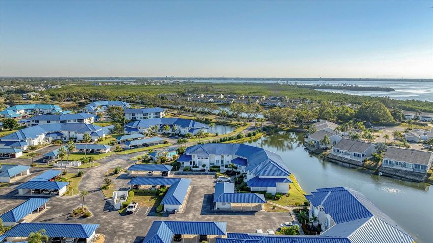 NEW PRICE!  Welcome home to Perico Bay Club!  This furnished 3 bedroom/2 bath first floor corner unit enjoys an open floor plan that takes in the serenity of the water view.  Your covered entrance takes you to your large foyer with 20’ tile flooring that leads to your open family room with views to your screened lanai.  Your kitchen was remodeled just 6 years ago with stainless steel appliances and Kraftmaid solid wood soft closed cabinetry.  Your primary bedroom enjoys a large walk in closet and its own slider to the lanai.  The en suite bathroom has a dual vanity, new toilet and tile enclosed walk in shower.  The TWO extra bedrooms have large windows with natural light, ceiling fans and built in closets.  They share the hall bathroom with new toilet and walk in shower.  All this in the beautiful gated community just 2 miles to Anna Maria Island, with large clubhouse, updated tennis and pickleball courts, kayak storage and a variety of events.  Come enjoy the Florida sun in the sanctuary of Perico Bay Club!