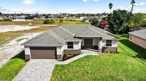 Photo of 928 NE 3rd Avenue, Cape Coral, FL 33909 (MLS # OM718678)