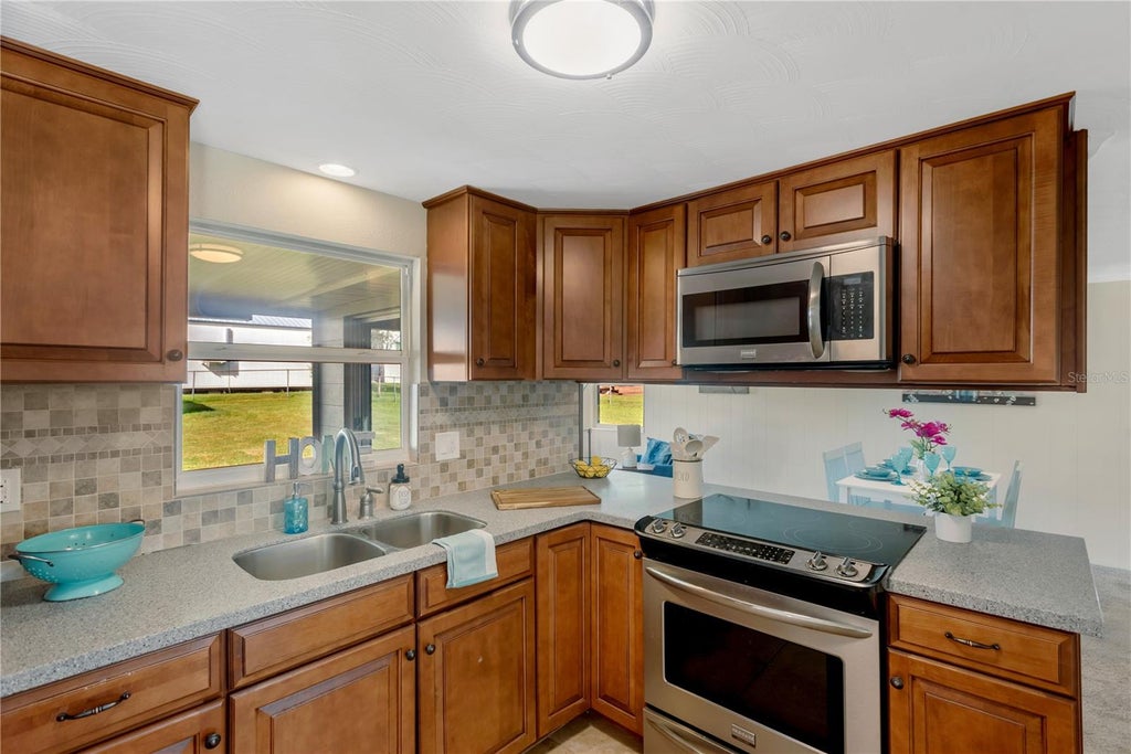 Photo of 13812 Meadow Oaks Drive, Dover, FL 33527 (MLS # TB8560419)