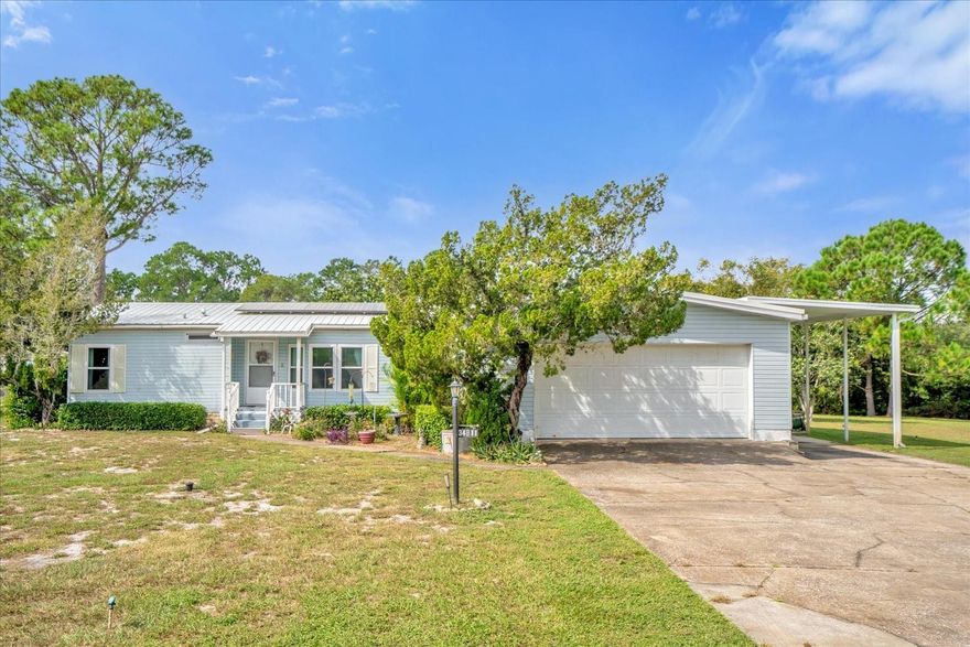 Welcome to this one owner, well maintained, home in Leesburg!  This home features 3 bedrooms that all have WALK-IN CLOSETS.  2 full bathrooms, split bedroom floor plan, spacious living/dining combo with built -in cabinets in the dining space, nook in the kitchen with cafe style doors and loads of natural light that flows through.  Making up the OVER 2800 total sf we have 1546 sf of living space with an added 165 sf Florida Room.  OVERSIZED ATTACHED.  FINISHED 2 CAR GARAGE, and ATTACHED RV CARPORT with electric, water and septic connections!  Improvements to this home include newer stainless steel appliances, newer laminate flooring, WINDOWS REPLACED 2009 with LIFETIME WARRANTY, METAL ROOF REPLACED 2004, SOLAR Assumable with a low interest rate of 1.4 % !  This home is situated on a 0.39 acre cul-de-sac lot offering plenty of space for a pool, garden, outdoor entertaining, etc.- there is NO HOA and is perfect for first time buyer to retirees, full time and seasonal residents as well!  It is MOVE-IN READY and eligible for all financing types!  Seller is motivated so schedule your showing today!