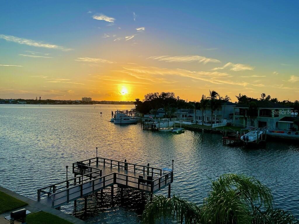 Live the dream in this STUNNING WATERFRONT CONDO! Imagine waking up to the breathtaking views of BOCA CIEGA BAY and watching dolphins, manatees, and boats from your spacious Florida Room. This 2nd floor condo in a 55+ community is minutes away from our award-winning St Pete Beach on the Gulf of Mexico and offers a host of amenities and features to make your life comfortable and enjoyable.
Beautiful and unique 2 bedroom/1-bathroom unit is move-in ready. RENOVATED KITCHEN with new stainless-steel appliances including a gas range (convection oven), quartz countertops, closet pantry, extra storage closet and the unit has SPLIT BEDROOMS with French doors to the Florida room. The primary bedroom has water views, can accommodate a king bed and includes two closets. 2nd bedroom also features water views and 2 closets. This unit comes with CROWN MOLDING throughout the unit except for the Florida room and Kitchen. The grand Florida room includes double pane windows along with an extra storage closet. The living room has recessed lighting and views of Boca Ciega Bay too. There are updates to the electrical wiring.
Please see the Interactive Floor Plan in the virtual tour.
The shingle roof was replaced in 2018 and the composite DOCK/FISHING PIER was replaced at the same time. Enjoy the seabreeze at the waterfront picnic tables accompanied with a gas grill. There's a bathroom close to the dock and a laundry room on every floor by the elevator along with a shared storage room. The community does not allow pets or leasing. The condo monthly maintenance fee ($693) covers cable/internet, gas, water plus much more and the building has a central gas boiler to save on the building and each units homeowners insurance. You will love the Shore community, with its large clubhouse just across the street, heated waterfront pool with bathrooms, fitness center, billiards and a kitchen for parties. You'll also enjoy the community waterfront grilling area and its picnic tables along the bay. The neighborhood is on a cul-de-sac and has a small bridge to a residential area (Paradise Island) that's great for taking a scenic walk. The Shore Dr S neighborhood is on the hospital electrical grid and power outages are rare. South Pasadena has plenty of shopping, restaurants, and medical facilities nearby, and the SunRunner Express bus can take you to the beach on the Gulf of Mexico or downtown St Petersburg with ease. St Pete Beach is just over the draw bridge and offers many water activities along with beach restaurants & bars. Also, enjoy a movie at the recently opened and renovated Beach Theater. Downtown St. Petersburg, with its unique restaurants, world-class museums and special pier is only a 19-minute drive away. You can also explore Artsy Gulfport on Boca Ciega Bay (12 minutes), Ft. Desoto Park with its 1,136 acres of pure bliss (20 minutes). Tampa International Airport is only 32 minutes away or catch a luxury cruise ship at the Tampa port for exciting ventures in the Caribbean. Don’t miss this opportunity to own your place in paradise, schedule a showing today!