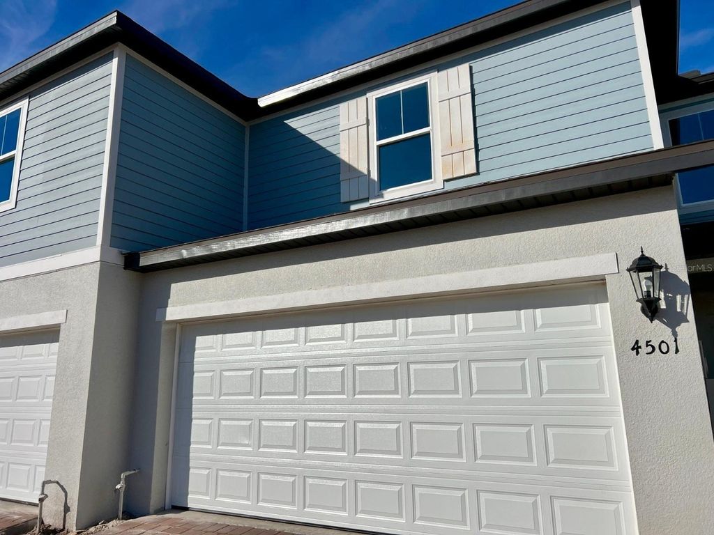 Photo of 4501 Burrowing Owl Loop, Saint Cloud, FL 34772 (MLS # O6403674)
