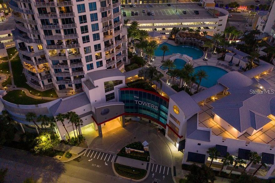 Escape to your own elevated paradise in this eleventh-floor retreat, where contemporary luxury meets the relaxed rhythm of Florida living. This stunning three-bedroom, three-bath residence boasts a smart split-bedroom layout and walls of glass that flood each room with golden sunlight and panoramic city and bay views.
Step out onto the expansive wraparound terrace — your private tropical oasis in the sky — perfect for morning coffee with a sea breeze or sunset cocktails surrounded by swaying palms below.
At the Towers of Channelside, resort-style living is an everyday indulgence. Enjoy a lush rooftop dog promenade, attentive concierge service, 24-hour security, and a spectacular pool deck featuring a heated spa and cascading rock waterfall that feels straight out of a Caribbean getaway.
Professionally managed and impeccably maintained, this coveted community places you in the heart of Tampa’s vibrant waterfront scene — just steps from Amalie Arena, the Riverwalk, Harbour Island, Water Street, and Armature Works.
Experience the best of Florida’s tropical lifestyle — where urban energy meets coastal serenity in perfect harmony.
