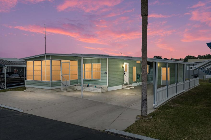 Set within the active and centrally located 55+ community of Spanish Trails
Village, this inviting 2 bedroom, 2 bath manufactured home offers comfortable
living with substantial practical updates including a 2024 roof, a 2018 AC, and an
expanded, covered 2 car carport with an added parking pad. The home opens
into a bright eat-in kitchen that immediately feels welcoming. It features a 4 piece
appliance package with a newer stainless steel refrigerator, a decorative
backsplash, and a handy passthrough window to the living room. The cozy
dinette is framed by bay windows and enhanced by ample built-in storage and a
charming chandelier, making it a pleasant spot for morning meals or casual
gatherings. The spacious living room flows naturally from the kitchen and dinette,
offering a comfortable place to relax with a ceiling fan and easy access to the
enclosed Florida room through sliding glass doors. This bonus space works
beautifully for extra seating, entertaining, or simply enjoying the neighborhood
atmosphere. Towards the rear of the residence, the primary suite provides
generous sleeping quarters along with a walk-in closet and an updated ensuite
featuring a walk-in shower, new vanity, new flooring, and a new toilet. The
secondary bedroom also includes a walk-in closet and ceiling fan, with the
second full bathroom nearby offering a tub/shower combination. An exterior
storage and laundry room provide extra convenience and function to the
property. Spend peaceful afternoons under the shade of the large covered
carport area, join friends at the community’s heated pool, spa, shuffleboard, and
clubhouse, or explore the many activities and conveniences of Zephyrhills just
minutes away. Call today for more information!