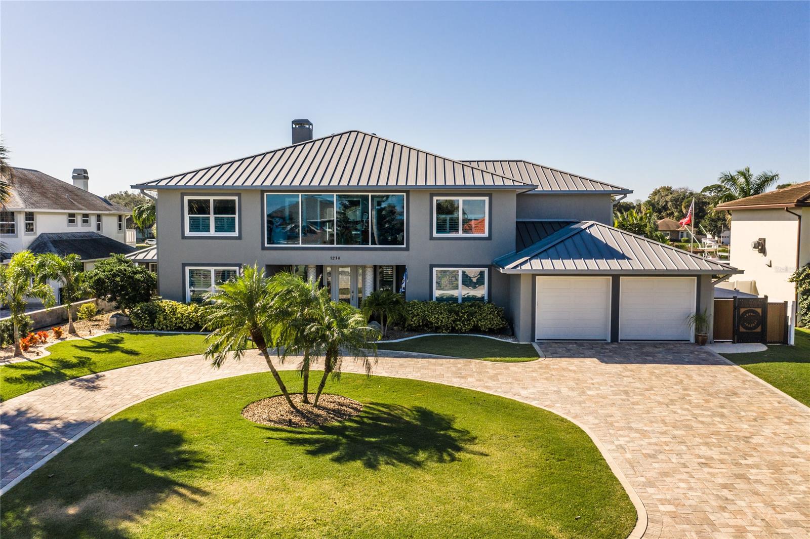 Imagine living on an island watching the sunset, as dolphins swim in your backyard? Here's your opportunity, this 5 bedroom 3 1/2 bath sits on the intracoastal waterways of the Indian River, in the heart of New Smyrna Beach. Just a short walk or golf cart ride you can be in historical downtown. Where you can enjoy everything Canal Street has to offer from fine dining, shopping and countless events throughout the year. For the outdoor lover, Ponce Inlet is a short 4-mile boat ride North, the gateway to some of Floridias best offshore fishing and diving grounds. A boat trip 3-miles south is the famous Mosquito Lagoon, which offers some of the best flats/ inshore fishing around.
You must come see this recently updated gorgeous two-story Luxury Intracoastal pool home. Stepping inside to this open design concept provides spaciousness with a mesmerizing view. The kitchen is a chef's dream, with all the high-end appliances so you can cook like a executive chef. There is an oversize 13X6 island making it perfect for entertaining all your family and friends. A customed crafted 10x13 separate panty providing plenty of storage space. There are two Master suites one located downstairs and one upstairs. The upstairs features a 3/2 split plan, with an entertaining area/ bonus room that has a custom-made bar area. The magnificent East & West windows allows you to enjoy the riverfront sunsets and breathtaking morning sunrises. For those pet lovers, don't worry they have their own room too. Located under the stairway, with an automatic doggy dog and fenced in area for them to play.
Enter your backyard oasis by either boat or land, where you can relax under your one of a kind 380 sqft covered summer kitchen. The covered kitchen provides ample space to host any outdoor gatherings. For those chilly winter nights, you can snuggle up with a glass of wine next to the natural gas firepit or in the steamy hot tub enjoying those pink winter skies. Now you can live where you vacation. ;Water: City
