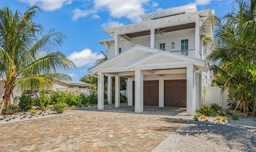 This recently constructed home on Anna Maria Island overlooking a stunning canal is just one block from the pristine Gulf of Mexico beaches and a short walk to the restaurants and boutiques on Pine Ave. This luxurious 5-bedroom, 5.5 bath retreat offers a spectacular backyard with a private pool and swim up bar, in-ground spa, a covered shellcrete patio with seating, a ping pong table, and a BBQ grill. The coastal home features two garages and a private drive accommodating four vehicles. The main living floor has an open layout with bright natural lighting, a plush living area with sofas and a TV. The kitchen is equipped with upgraded stainless steel Bosch appliances and quartz countertops. There are many dining areas including the cozy kitchen nook, kitchen island, formal dining room, or on the balcony overlooking the canal. The 5 beautifully designed bedrooms feature elegant decor, chic furnishings, bedside lighting, and ensuite bathrooms. The second floor houses 3 bedrooms with king beds and full baths, a half bathroom for guest use, and a walk-in laundry room with a washer and dryer. The third floor includes a seating area with a table and chairs, a TV area, a wet bar, and two primary suites accessible by elevator or stairs. These suites feature king beds, private terraces, walk-in closets, and ensuite bathrooms with large glass-walled showers. Additionally, the rooftop deck provides an ideal spot for relaxation and taking in the views. This home offers a blend of luxury, comfort, and convenience, making it an exceptional choice for your Anna Maria Island life!!