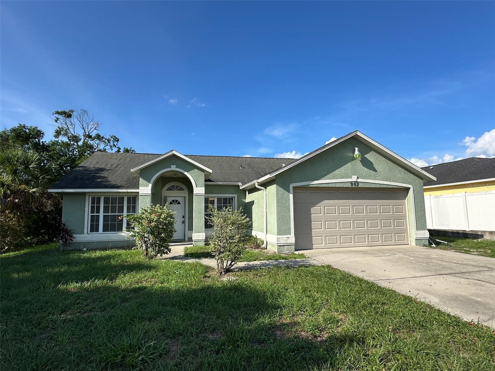 Absolutely charming 3 bedroom 2 full bathroom 2 car garage home in lovely Deltona. This beautiful home is sparkling clean and ready for new owners with recent updates including BRAND NEW INTERIOR PAINT THROUGHOUT, BRAND NEW KITCHEN COUNTERTOP RESURFACING, NEWLY PAINTED KITCHEN CABINETS, and BOTH BATHROOM SHOWERS REMODELED IN 2024. Additional upgrades include the installation of a new GARAGE OPENER in 2024, a new HOT WATER TANK in 2022, a new SEPTIC in 2021, the HVAC replaced in 2017, and ROOF replaced in 2011. Light and bright floorplan is highlighted by stylish tile throughout all the common areas and bathrooms. Large family room leads to oversized rear screened porch, perfect for outdoor living and entertaining. Great home, view today.