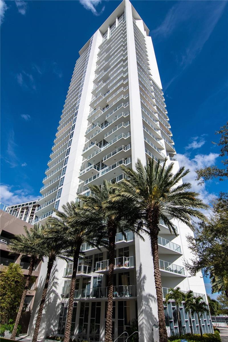 CORNER CONDO WITH WATER & CITY VIEWS! This generously sized 1 bedroom, 1 1/2 bath condo with Den features an open floor plan with floor to ceiling glass windows that offer spectacular views and plenty of natural light. Boasting numerous upgrades, such as tile plank flooring throughout, high-end built-in cabinetry and office, quartz countertops in a colorful art deco style kitchen with glass backsplash, top of the line appliances. Sliding glass doors lead to your own spacious wrap around terrace that overlooks the pool and enjoy views of the sparkling Tampa Bay waters and downtown St Pete. You can also catch an aerial view of a Rowdies soccer game, watch the planes take off and land from Albert Whitted, or just sit back and relax watching the boats sail in and out of the marina. Signature Place is located in the heart of downtown St. Petersburg and is one of the most iconic condo buildings known for its modern architectural appeal. Residents of The Signature enjoy a wide range of amenities, including a rooftop pool and sundeck with panoramic views, a fully equipped fitness center, and a resident lounge. The building also offers 24-hour concierge service, ensuring convenience and security. Located just steps away from vibrant downtown St. Petersburg, you'll have easy access to dining, shopping, and entertainment options. Explore the local art galleries, enjoy live music at the nearby venues, or take a stroll along the waterfront parks. Schedule a showing today and experience luxury living at its finest in St. Petersburg, FL!