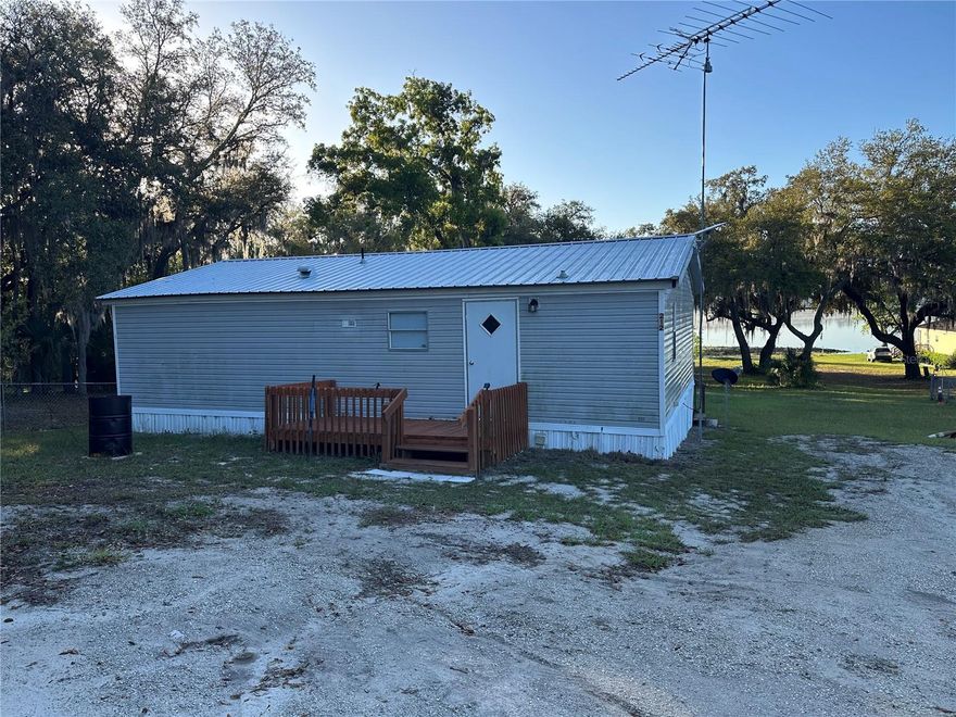 Discover the perfect blend of comfort, privacy, and true Florida lake life with this well-kept manufactured home situated on .92 acres overlooking the beautiful Bream Lake. This 3-bedroom, 2-bath home offers a peaceful retreat with plenty of space to relax, entertain, and enjoy nature.Step outside onto the wood deck where you can take in breathtaking sunrises, over Bream Lake- a 164-acre, spring-fed lake known for its clear water, quite atmosphere, and excellent recreation. With no public boat ramp, residents. enjoy a more private lake experience perfect for motor boating, swimming, and fishing. Anglers will appreciate the abundance of bass, crappie, and catfish right at their doorstep.The property includes an 12' X 24' storage building ideal for housing all your lake toys, fishing gear, and outdoor equipment. The spacious lot provides  room to garden, play, or simply enjoy the peaceful surroundings.Conveniently located just minutes to Hawthorne and a short drive to Gainesville, this home offers easy access to shopping, dining, and major conveniences while still feeling like a private getaway. If you're looking to embrace relaxed lakefront living with no HOA, this property delivers the lifestyle you've been dreaming of.
