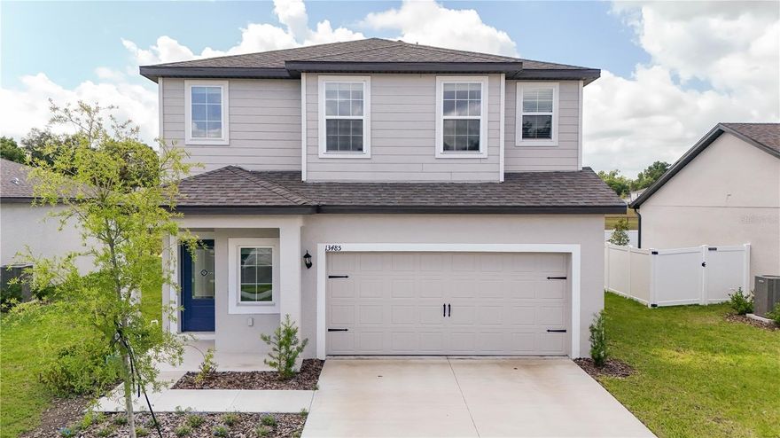 Welcome to the Driftwood plan in the desirable Tula Parc community in Astatula! This beautifully designed home offers exceptional curb appeal with professionally landscaped front yard and a thoughtfully crafted open-concept layout perfect for modern living. The chef-ready kitchen serves as the heart of the home, featuring granite countertops, 36” upper wood cabinets with crown molding, Moen® faucets, and a full suite of energy-efficient Whirlpool® appliances, including refrigerator, stove, microwave, and dishwasher. The kitchen seamlessly flows into the spacious dining and family rooms, creating an ideal setting for entertaining and everyday living. Enjoy indoor-outdoor living with a covered back patio, perfect for gatherings or relaxing evenings. The private primary suite is filled with natural light and includes a spacious walk-in closet and an en-suite bathroom with double-sink vanity and step-in shower. Located near Little Lake Harris, Tula Parc offers a tranquil setting with convenient access to outdoor recreation, including boating, fishing, hiking, and golf. Don’t miss this opportunity to own a beautifully upgraded home in a growing community!
