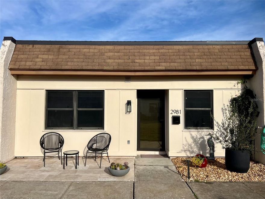 Welcome to this fully updated 2BR/2BA villa in the 55+ Mission Hills community! Move-in ready, this home blends modern luxury with total peace of mind. The open floor plan features elegant herringbone ceramic tile throughout. A chef’s dream kitchen boasts custom quartz counters, a coffee bar, and new stainless appliances—including a rare gas stove. Retreat to the primary suite with custom closets and a spa-like en-suite, while a stylish barn door creates a completely private guest wing. While both baths feature high ceilings, a Shower Tower with rain heads awaits for indulgent pampering in the primary bath. Enjoy worry-free living: located high and dry in Flood Zone X (non-evacuation, no flood insurance required!). Community perks include a heated saltwater pool and clubhouse. Just a short stroll to Bayside Plaza and minutes to Safety Harbor and Gulf beaches. Your Florida lifestyle awaits! Professional photography available soon!