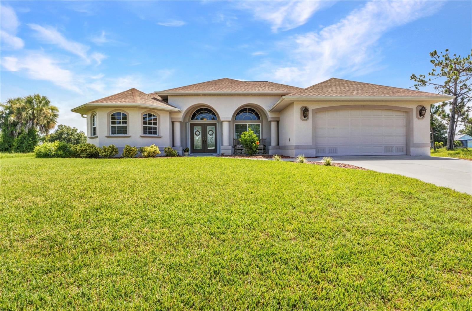 Stunning Pool Home with River Views in Rotonda West – No Flood Insurance Required
Welcome to your Florida dream home! This beautifully maintained 3-bedroom, 2.5-bathroom residence is located in the highly desirable community of Rotonda West and offers the perfect blend of comfort, quality, and peace of mind. With full impact windows, hurricane film on the sliders, and no flood insurance required, this home was built for both beauty and durability. As you enter, you'll notice the beautiful Bottocino marble floors from Italy laid on a diagonal. You’re immediately greeted by an open layout and a stunning view of the sparkling saltwater heated pool, framed by lush landscaping and tranquil views of the Rotonda River. The formal living room features a large sliding door to the lanai, creating a seamless indoor-outdoor flow. A formal dining room nearby provides a perfect setting for family gatherings or dinner parties. The primary suite is a peaceful retreat, complete with luxury interlocking waterproof laminate floors- two separate walk-in closets and sliding glass doors leading to the lanai. The ensuite bathroom offers a luxurious escape, featuring two separate vanities, a jetted soaking tub, and a unique walk-in shower with dual entrances and two shower heads. Natural light floods the space, creating a spa-like ambiance. The gourmet kitchen is designed for both style and function, equipped with stainless steel appliances, quartz countertops, a center island, breakfast bar, and a sunny dinette with an aquarium window offering a panoramic water view. The kitchen opens to a spacious family room, also with sliding doors to the lanai, making entertaining a breeze. The home’s split floor plan places two spacious guest bedrooms and a full guest bathroom on the opposite side of the house for maximum privacy. Bedroom two includes a walk-in closet, while the guest bath features a tub/shower combo ideal for visiting family or friends. A full-sized laundry room includes a washer and dryer along with built-in cabinetry for extra storage. The two-car garage offers built-in storage and a sleek epoxy floor finish, keeping things clean and organized. Throughout the home, you’ll find surround sound with intercom speakers in each room, enhancing your audio experience whether relaxing indoors or entertaining on the lanai. The outdoor space includes a large covered area, a screened lanai, and a private dock overlooking the Rotonda River, offering peaceful sunset views or a place to launch a kayak or enjoy a quiet morning by the water. Recent updates include a new roof in 2022, a new A/C in 2021, and impact windows and doors installed in 2021. The RainTree irrigation system helps keep your lawn lush year-round. Rotonda West is one of Florida’s premier golf course communities, offering a laid-back lifestyle with access to multiple championship courses, world-class fishing, nature preserves, and the serene sandy beaches of the Gulf Coast just a short drive away. Punta Gorda Airport 30 mins, Sarasota Airport 45 mins and RSW is an hours drive. Whether you’re an avid golfer, a boating enthusiast, or simply looking for a serene Florida retreat, this home has it all.