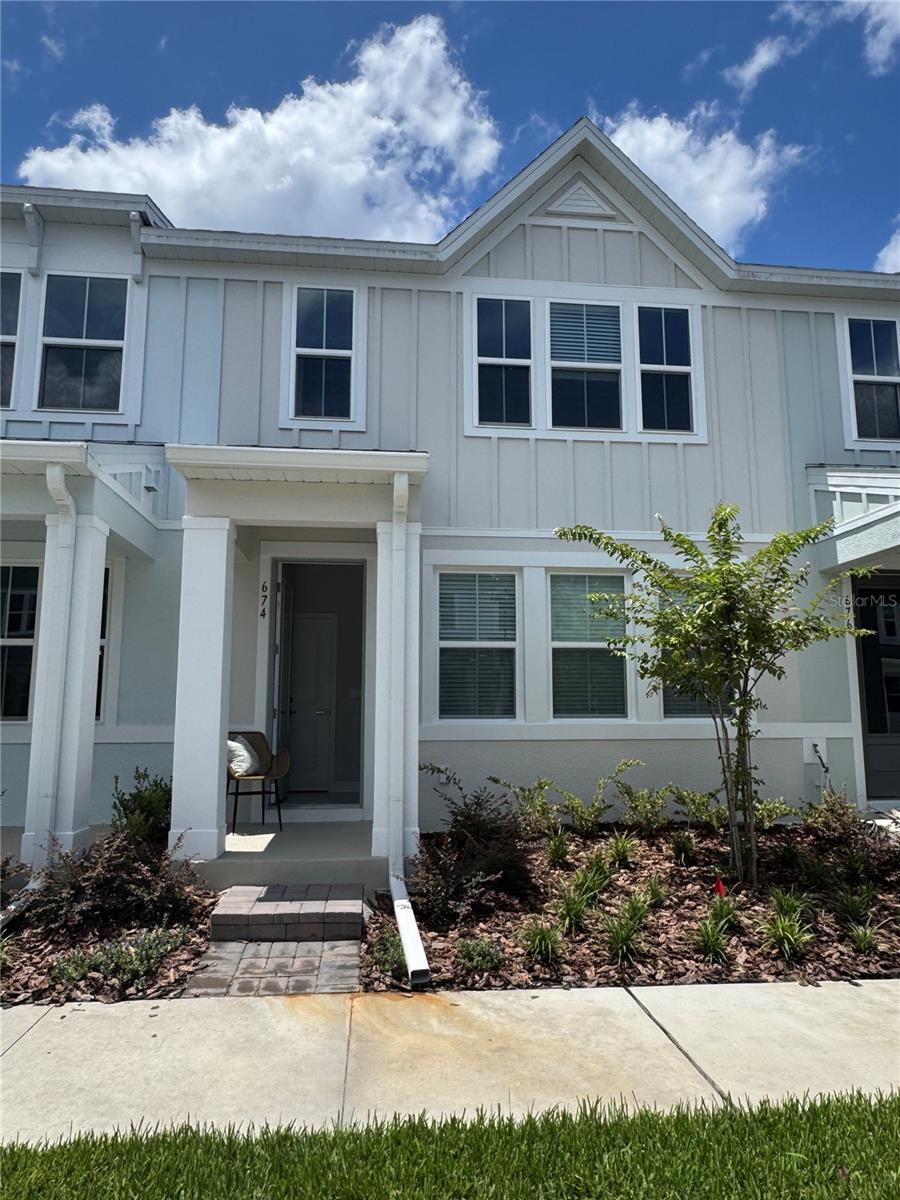 Absolutely Brand-New Townhome with a two-car attached garage in the conveniently located community of Rivington! This luxurious and well-designed home has a space for everyone to enjoy. The ground floor is an open and comfortable gathering area with a gorgeous kitchen at the center and living and dining spaces on either side. The perfectly placed Granite Island and fingerprint-resistant stainless steel appliances complement the light gray cabinetry. A powder room and large walk-in pantry complete the lower level. All three bedrooms and both full bathrooms are on the upper level, along with a generous flex space that separates the primary oasis from the secondary bedrooms and bathroom. Storage space abounds with an oversized walk-in closet in the Primary Bedroom, a linen closet, and walk-in closets in each of the secondary bedrooms. The upstairs laundry room with a full-size washer and dryer will save steps and time! Ceiling Fans in each bedroom and both living areas offer comfort and efficiency, and 2" cordless custom blinds on all windows provide privacy. Residents of Rivington can enjoy the clubhouse and resort-style pool, as well as the playground and reflection pond. With the Sun Rail walking distance away, commuting to downtown is a breeze! Hiking and Biking enthusiasts will be amazed by Alexander Island Park and Gemini Springs Park just around the corner. Debary is a lovely little town close to great shopping and dining, with Deland, Sanford, Lake Mary, and Orlando minutes away. Be the first to claim this wonderful new home as your sanctuary.