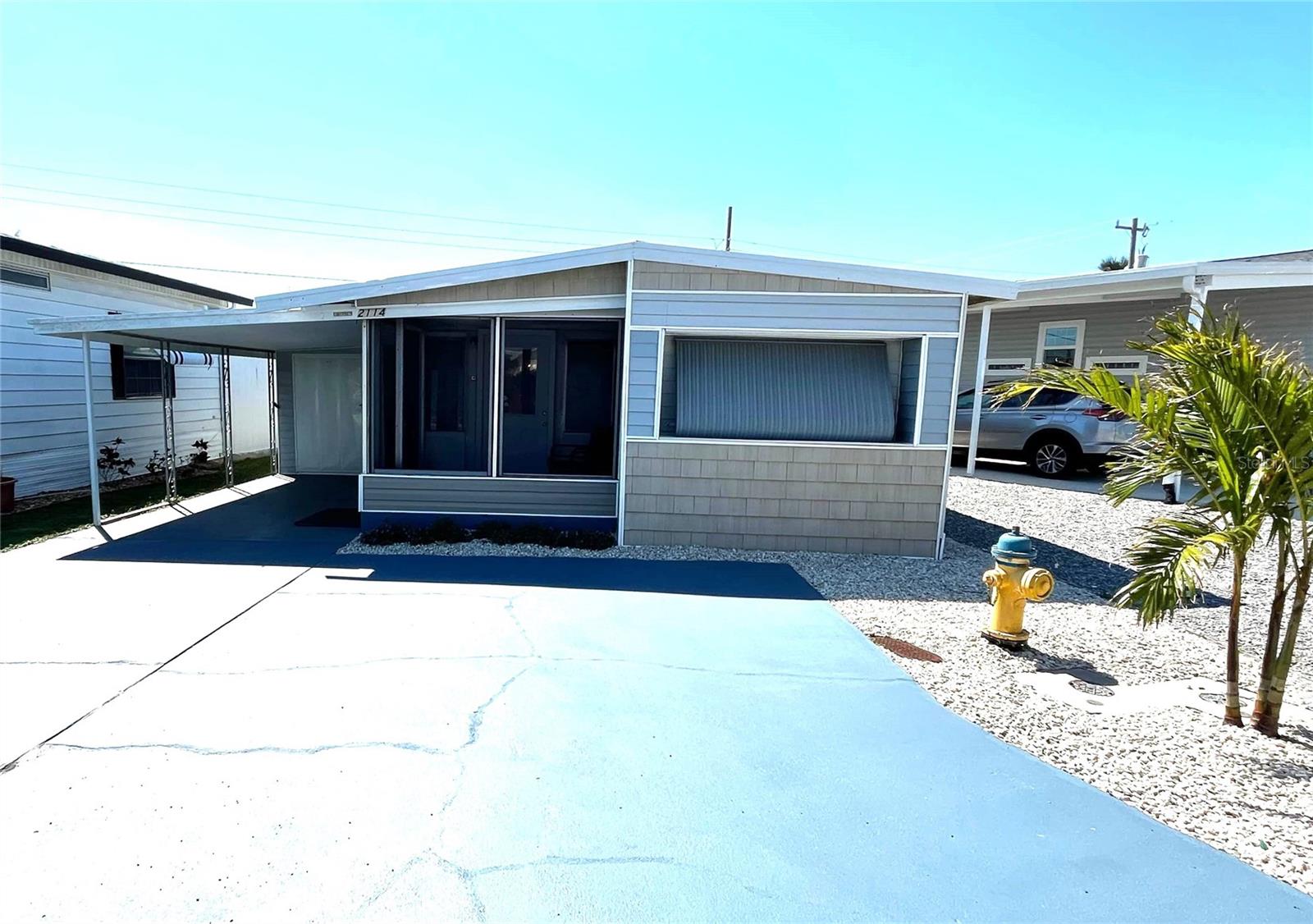 This three-bedroom, multiple-bath coastal home in the highly sought-after 55+ marina community of Trailer Estates is a charming and cozy retreat. Featuring shingle-style front-facing siding, this home offers curb appeal and coastal charm. Offered fully furnished and turnkey, it is ready for immediate enjoyment. A screened porch provides the perfect spot to relax, while inside laundry adds to the home’s convenience. With plenty of parking, this home is both functional and inviting. Trailer Estates is a self-governing Special Park and Recreation District, where land ownership ensures stability—no lot rent, CDD, or HOA fees. The stated annual tax includes a park fee that covers cable, internet, trash pickup, fire and rescue services, and community amenities. Residents enjoy access to a marina with rentable boat slips, a community beach with pavilion, a pool, hot tub, fitness center, shuffleboard, pickleball, bocce ball, and over 60 clubs and social events. Whether you love community dances, art classes, or simply unwinding by Sarasota Bay, Trailer Estates offers an unmatched coastal lifestyle. Don't miss this opportunity to own in one of the area’s most desirable 55+ communities. Buyer to verify square footage and details.