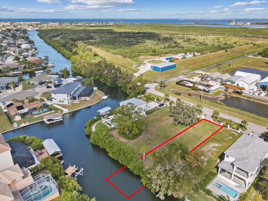Live where luxury meets the waterfront at 552 Estuary Shore Ln in Apollo Beach, FL. Building plans are available for this 135x42 ft direct waterfront lot located along the pristine shores of Tampa Bay in the exclusive, gated Estuary community. This boater’s paradise is ideal for a 30-35 ft vessel, with space to build your private dock and lift, offering immediate access to Tampa Bay and the Gulf of Mexico. Whether it's fishing, paddleboarding, jet skiing, or sunset cruising, the water is your backyard playground. Enjoy the peaceful privacy of a gated neighborhood with a low annual HOA fee, all while being just minutes from Downtown Tampa, TGH-Moffitt Cancer Center, USF Health, top dining, shopping, and quick access to I-75. Nature lovers will appreciate proximity to the Tampa Bay Turtle Sanctuary, and golfers will love the nearby premier courses. All public utilities—water, sewer, electric, and cable—are available, making for a smooth and ready-to-build process. Whether you’re envisioning a custom waterfront dream home or a high-end spec build, this rare lot offers the opportunity to live like you're on vacation every single day. Call today to make this one yours now! Video Tour Here: https://youtu.be/1OZYfYg81rc