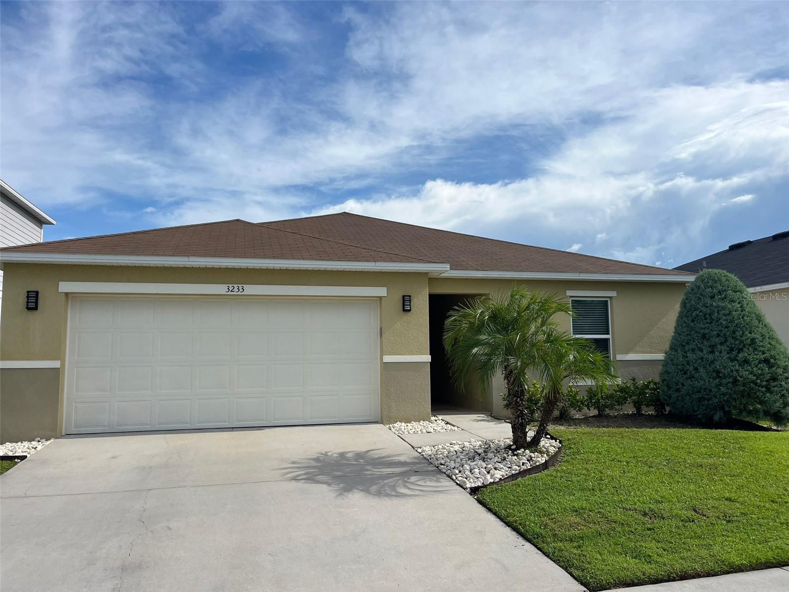 Eagle Hammock Community – Osceola County Beautiful 4-bedroom, 2-bathroom home built in 2020, located in the desirable Eagle Hammock community. This home features an open floor plan with 24x24 tile flooring throughout, except for the movie theater room, which is carpeted and soundproofed for the ultimate viewing experience. The large kitchen offers ample space and flows seamlessly into the dining area and open living room, perfect for entertaining. One wall in the living room showcases a waved tile accent, adding a touch of modern elegance. A 5x8 mirror in the living area enhances the space by reflecting light and design elements. Additionally, there is a glass door that leads to modern bar area featuring a beverage cooler, perfect for entertaining friends and family. One of the bathrooms features a unique 3D wood accent wall, creating a standout design detail. Eco-friendly upgrades include a whole-house water filtration system and an energy-efficient hybrid hot water heater. The home is also equipped with a sprinkler system, ensuring a well-maintained exterior year-round. ****Home square footage, taxes, lot sizes, and schools; are to be independently verified.***