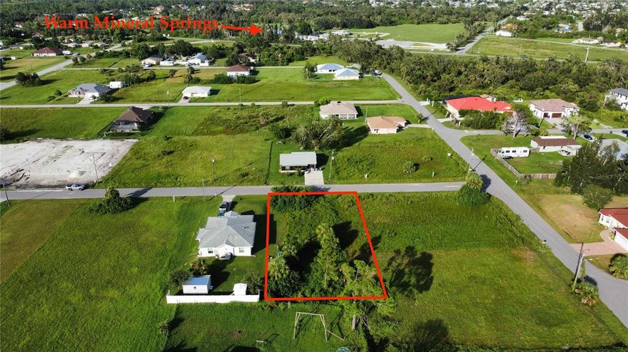 Building lot walking distance to the Warm Mineral Springs park.  Minutes to all services.  Great opportunity to build an income-producing short or long-term rental.  No scrub jays or other issues.  Short driving distance to the beaches, Atlanta Braves Stadium, master-planned Murdock Village area and Downtown Wellen.