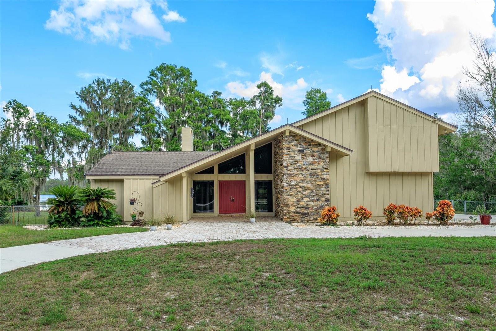 Serene Country Living with Lake Views on 15 Acres
Discover peaceful, HOA-free living on this stunning 15-acre property, where open fields, privacy, and tasteful landscaping surround a home full of warmth and character. Enjoy scenic lake views and relax in the quietude—set a quarter mile from Highway 33 to provide seclusion without sacrificing convenience.
This inviting custom built home blends rustic charm with modern updates. Step inside to be greeted by elegant stone floors and a beautiful standing wood design that flows throughout the space. Natural light pours in through an abundance of windows, enhancing the cozy, giant airy open concept.
The main level features a spacious primary suite, a large utility room, and a modernized primary bathroom and dressing area. The heart of the home includes a gorgeous wood-burning fireplace, exposed wooden ceiling beams, a generous wraparound breakfast bar, and a functional open layout perfect for gatherings.
Upstairs, a spiral staircase leads to a versatile loft area—ideal as a home office, guest retreat, or creative space. Upstairs also includes brand-new carpet in the bedrooms and vinyl plank flooring in select rooms and bathrooms.
Additional features include:
Custom teak flooring throughout main areas
Stainless steel appliances
Bonus loft space upstairs
Two-car garage with circular driveway and extra parking
Excellent closet and storage space
Spacious wraparound wooden deck with multiple sliding doors opening to lake and nature views
Home on well water with a water softener system
Lawn care made simple: The tenant is only responsible for maintaining the landscaped area surrounding the home (approximately 1 acre). The owner will take care of the remaining 14 acres along the driveway and open fields.
This one-of-a-kind property offers the perfect blend of nature, comfort, and character. Come experience the charm and freedom of this remarkable home for yourself.